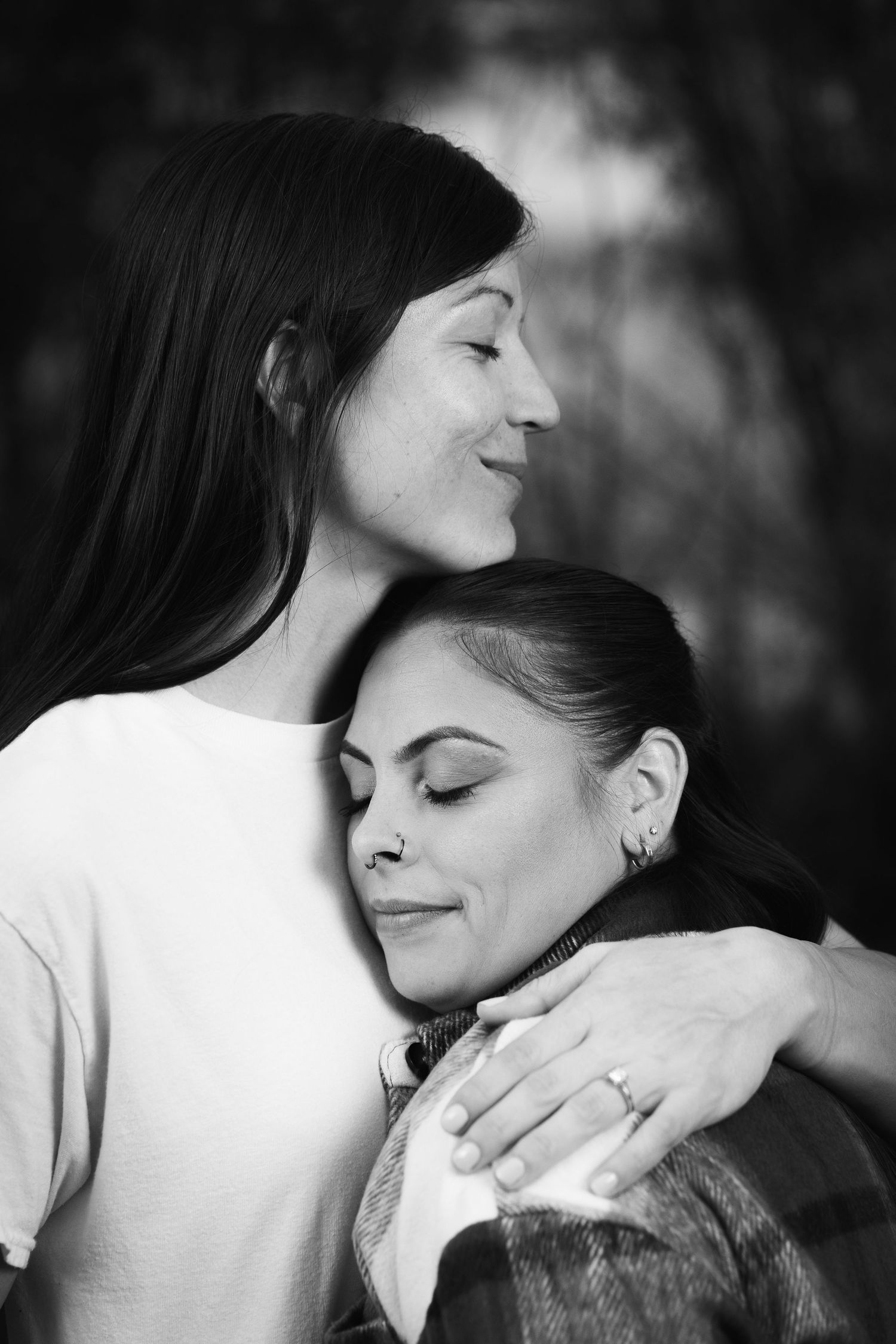 Black and white portrait of two women in a tender embrace — heartfelt family photography in Littleton, CO.