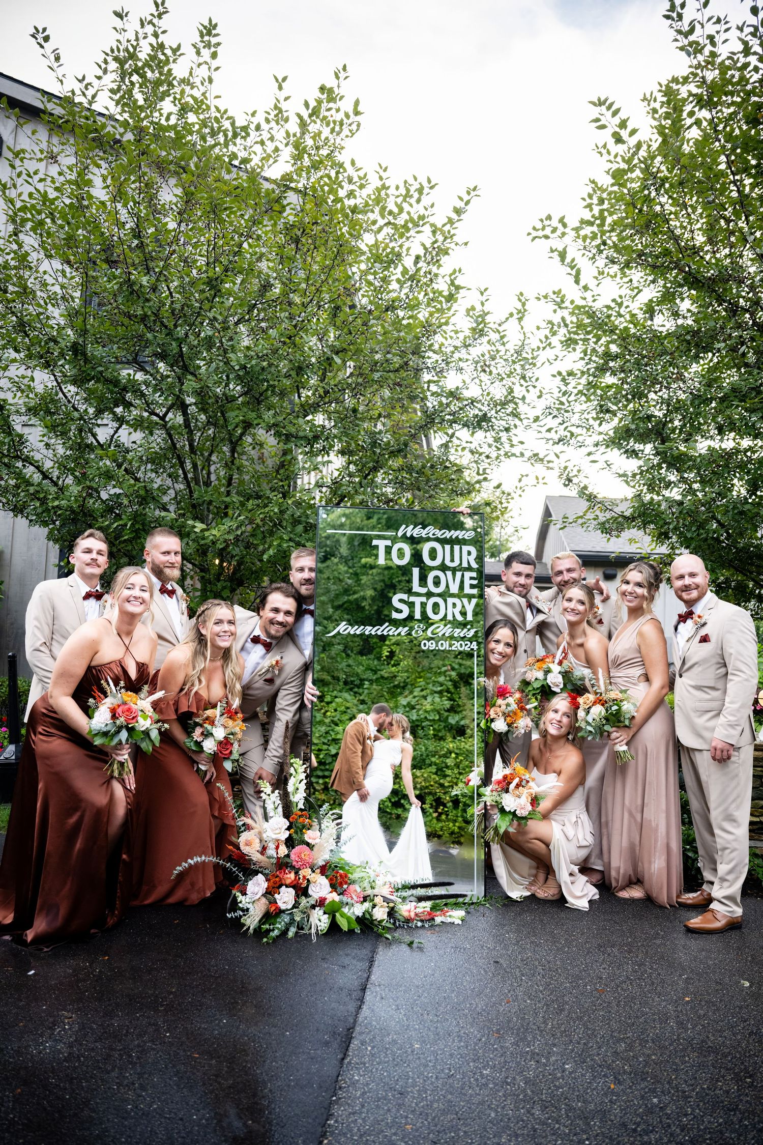 Wedding party poses together outdoors in brown and beige attire for creative group photo sequence on dark pavement.