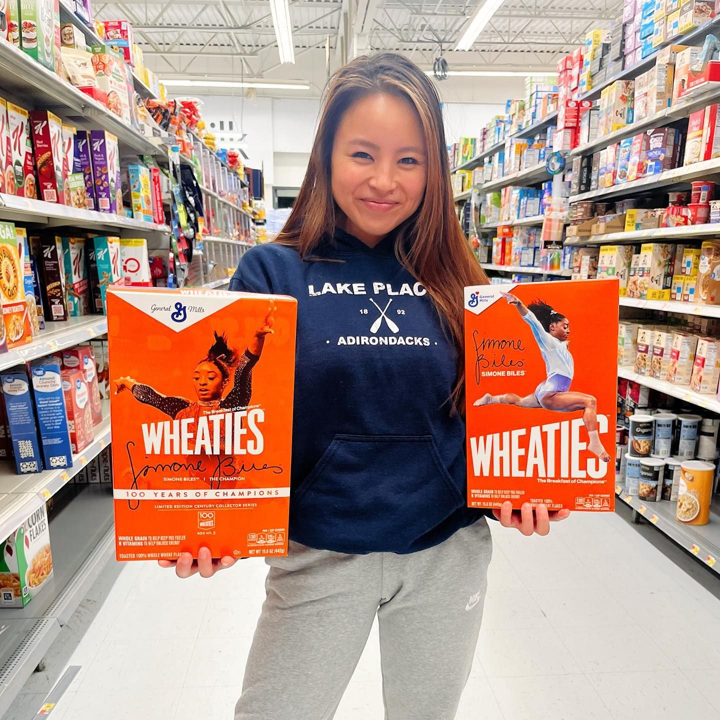 Allison Mott in Hartford, CT, seeing her Simone Biles Wheaties box on shelves. Joyful branding moment for a CT wedding photographer