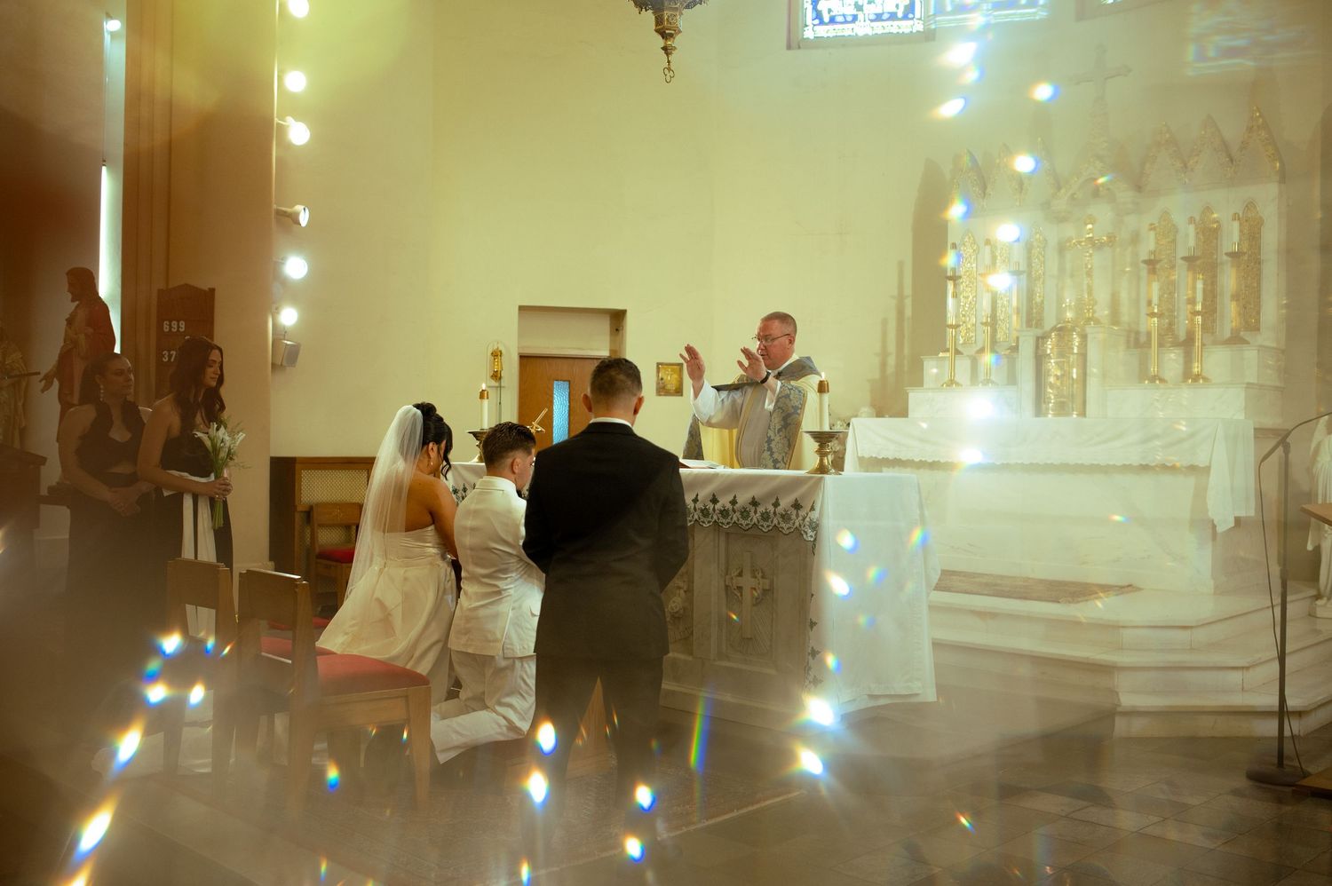 Dimly lit church interior with glowing lights and religious decorations.