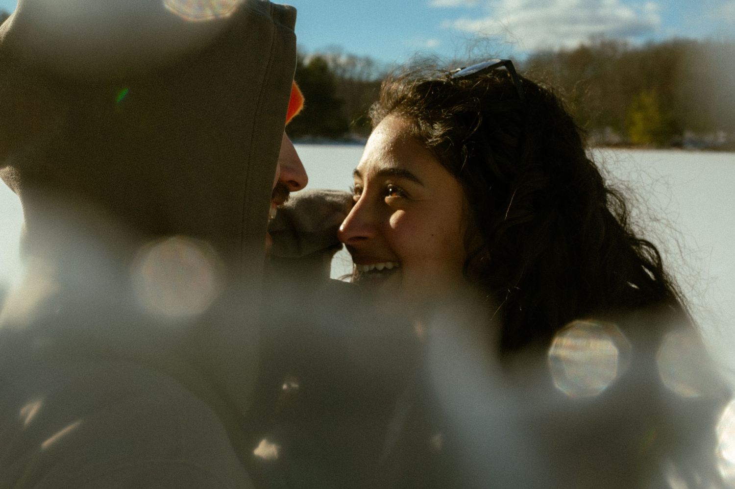 Dreamy outdoor landscape photo with bokeh lights and soft focus clouds in the background.