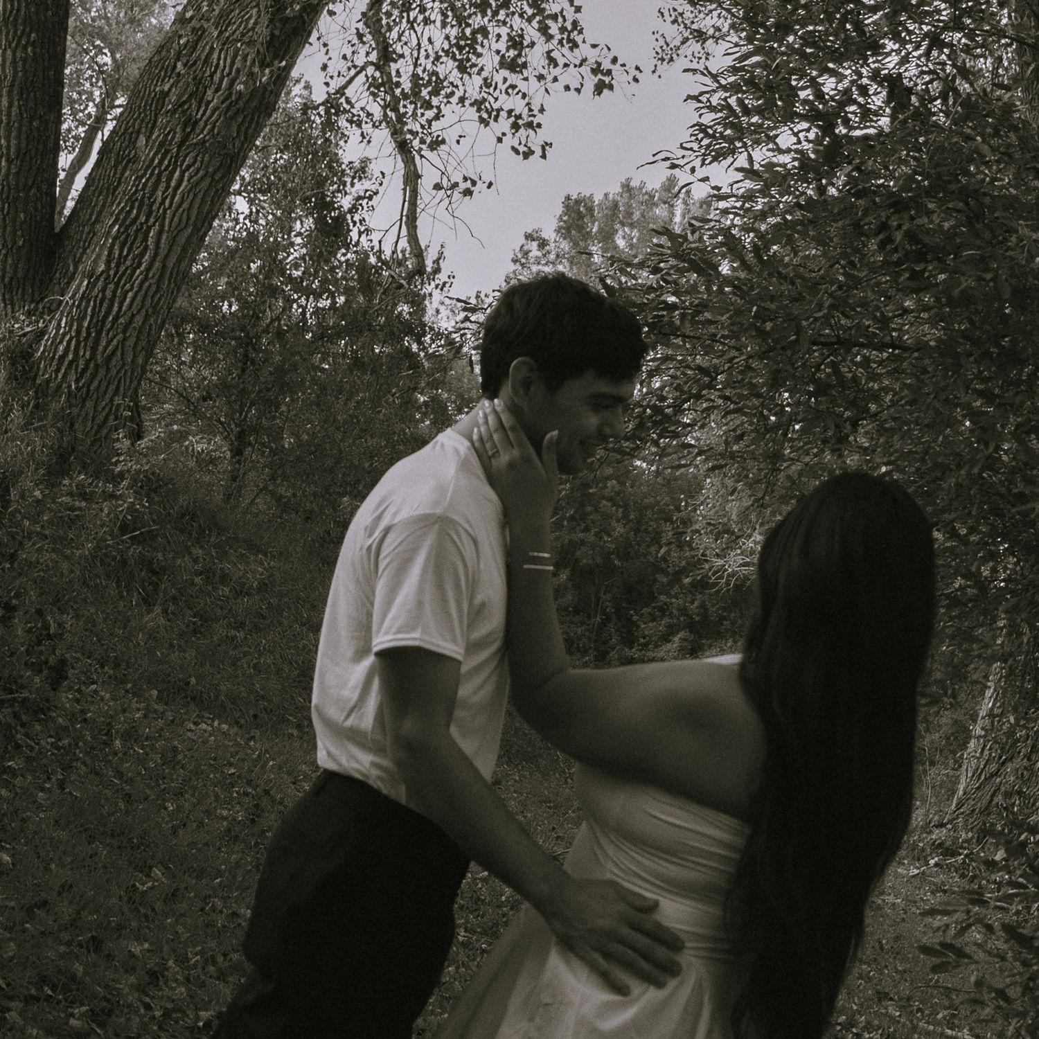 Couple admiring each other in black and white.