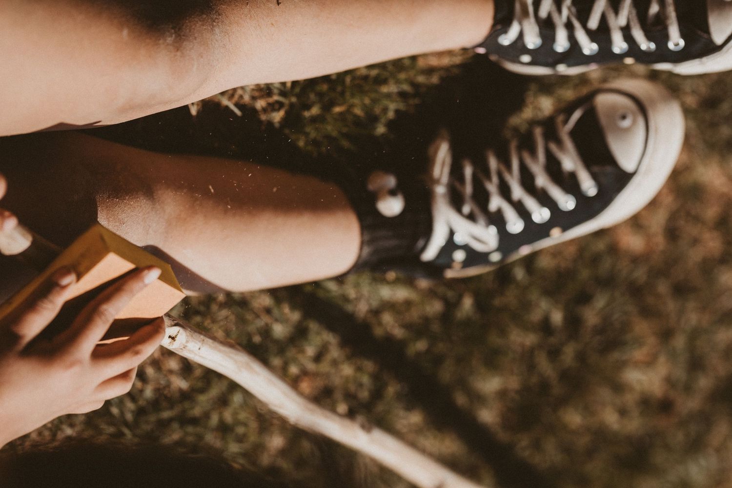 Close-up detail of black and white checkered sneakers.