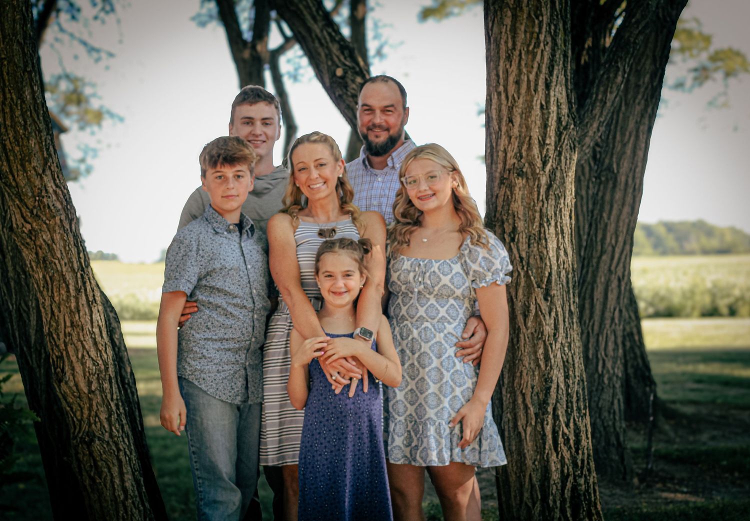 A family photo between trees