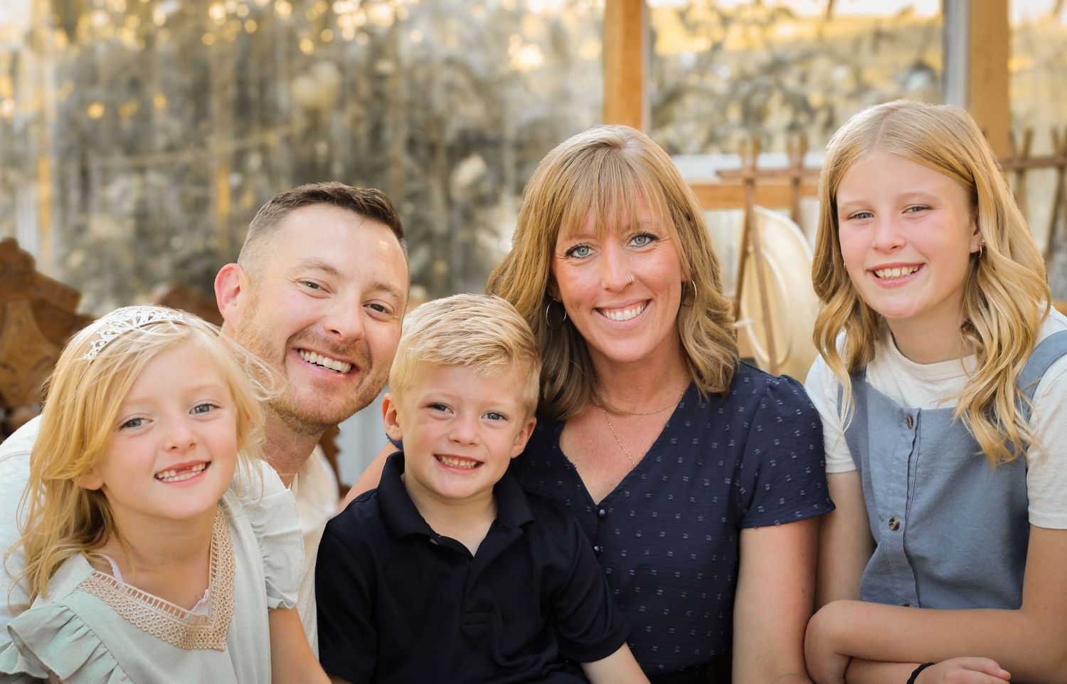 a family smiling for a photo