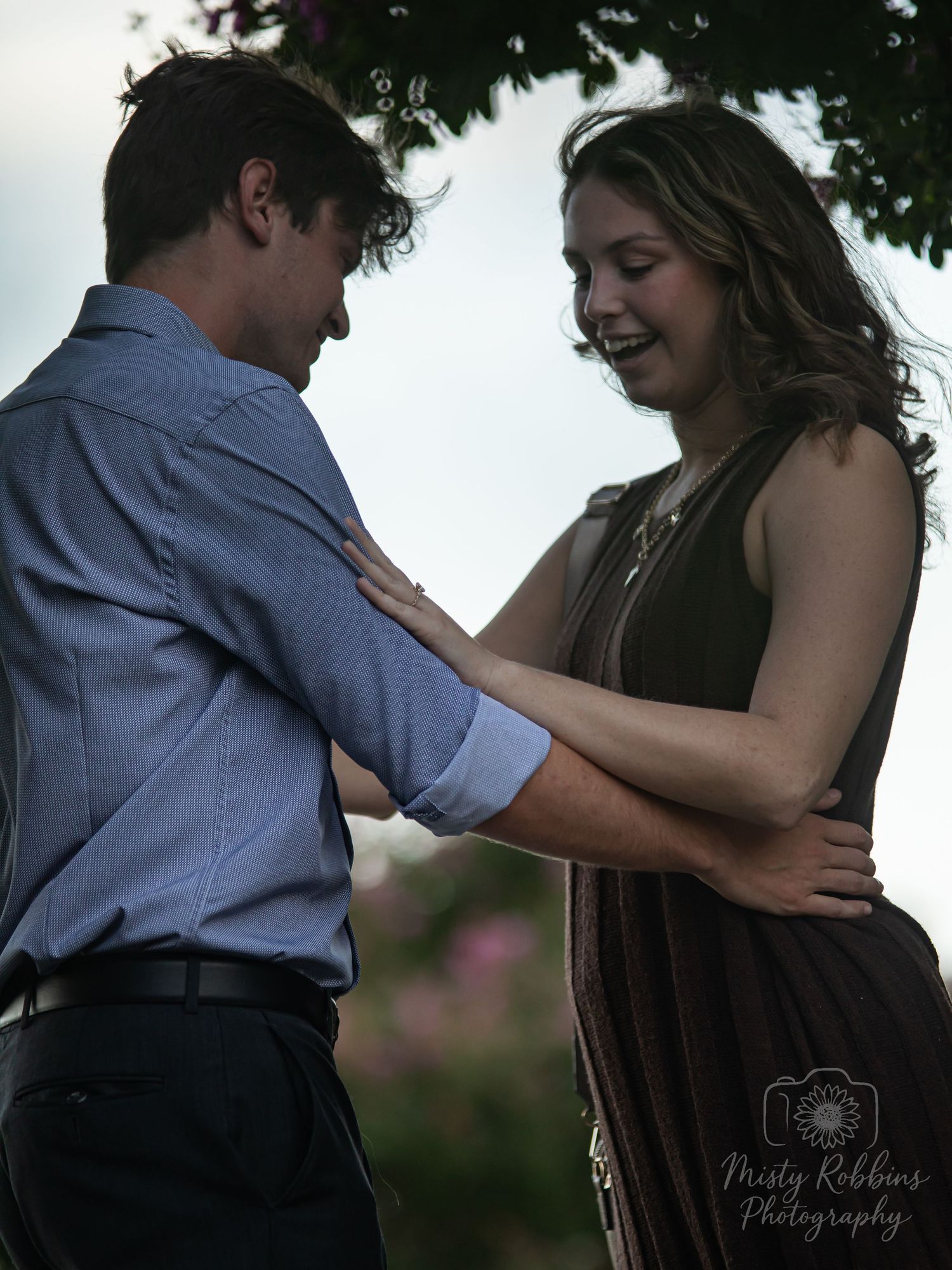 A couple in formal attire dancing together outdoors, shown in a series of romantic poses at dusk.