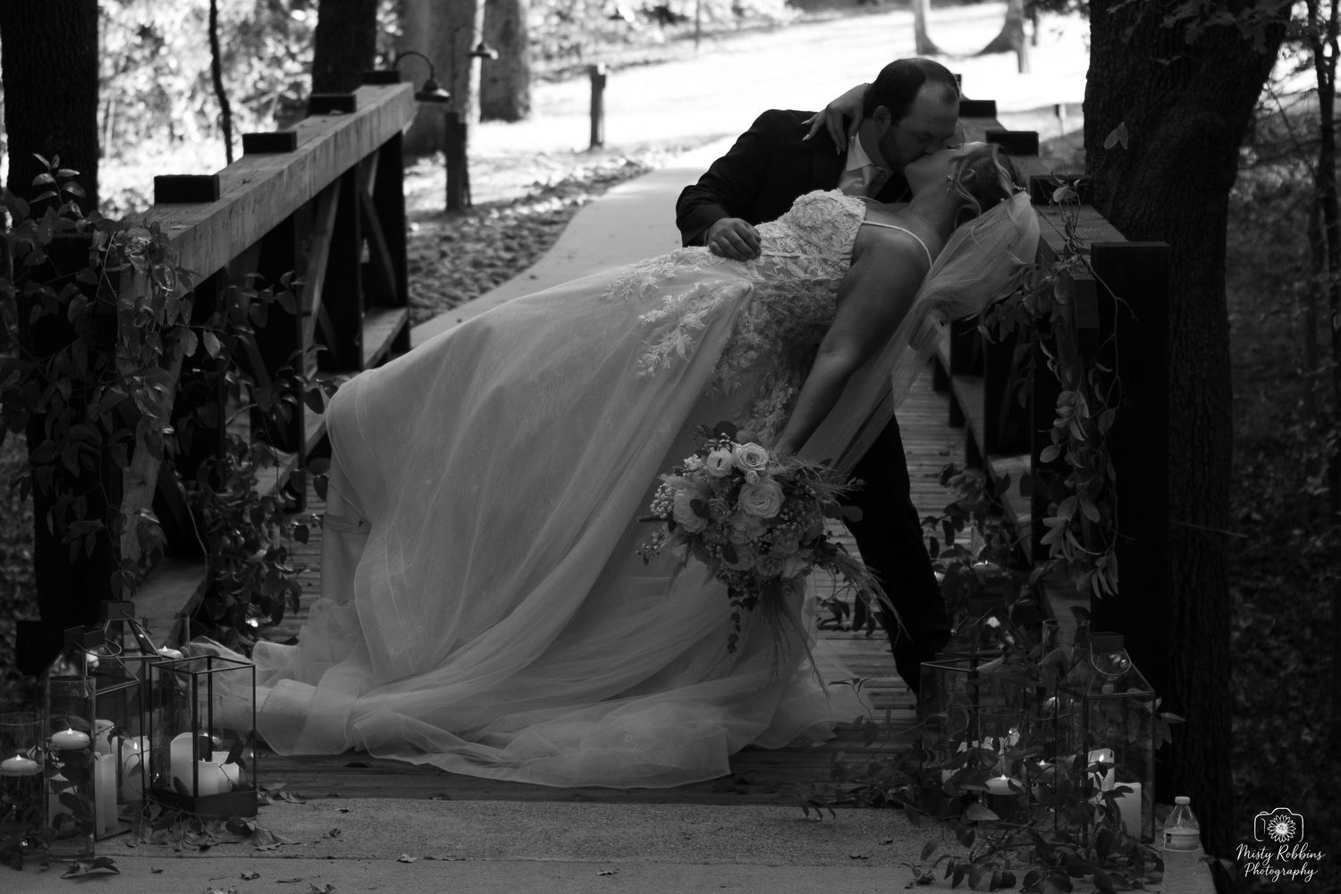 A black and white collage of wedding photos showing romantic moments in an outdoor garden setting.