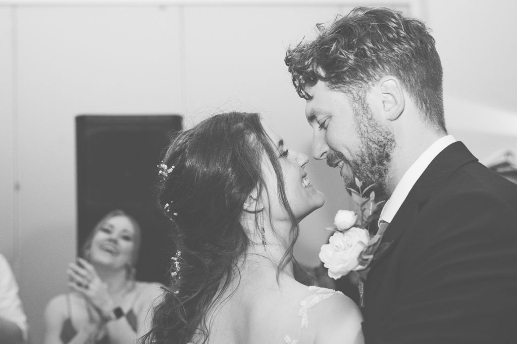 Black and white wedding reception photos capturing dancing and celebration.