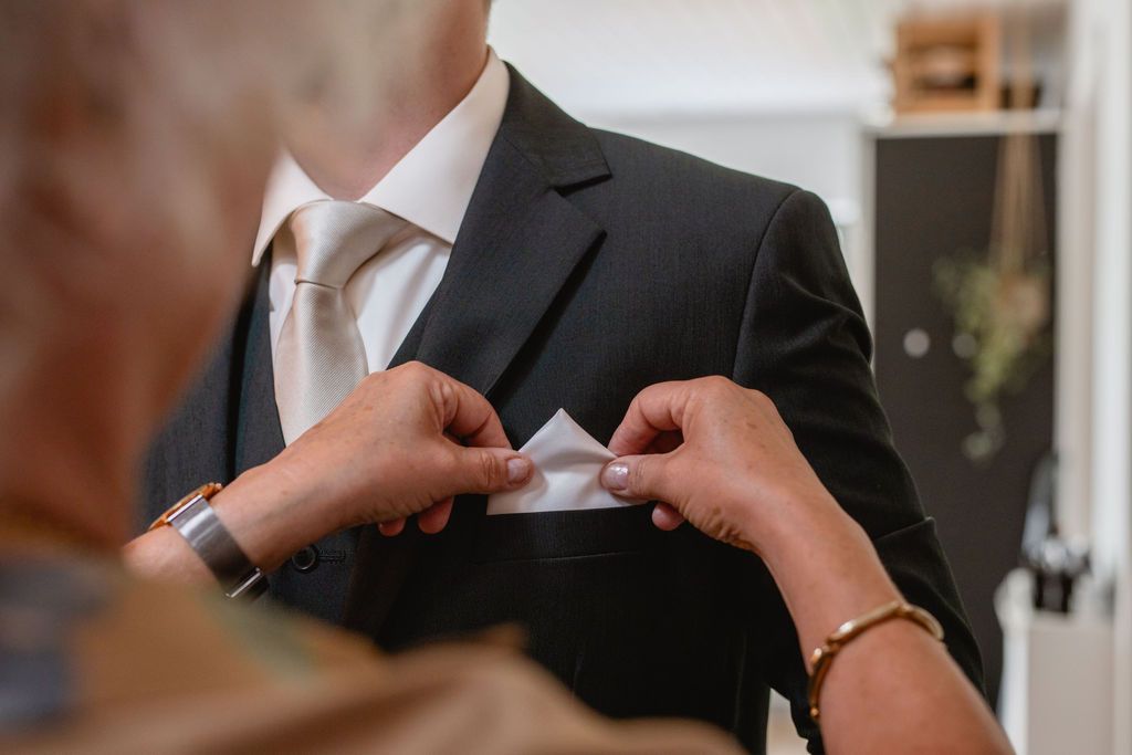 Close-up of wedding details and intimate moments during celebration.