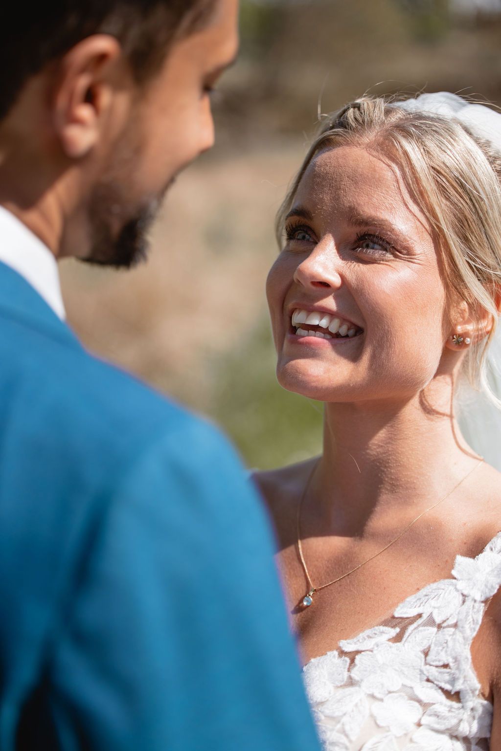 Candid wedding portrait capturing genuine laughter and joy between the couple.