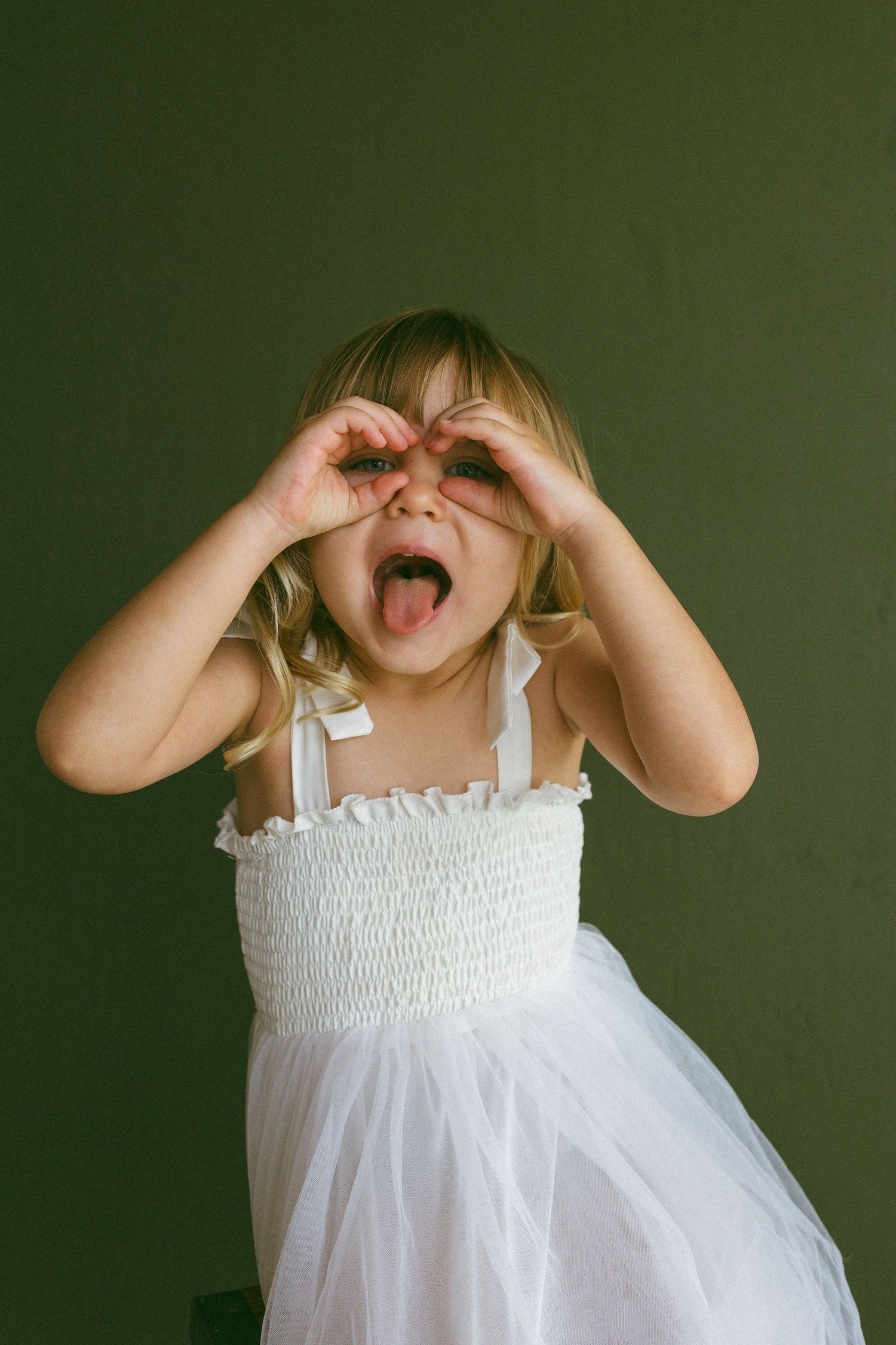 young girl being playful for the camera