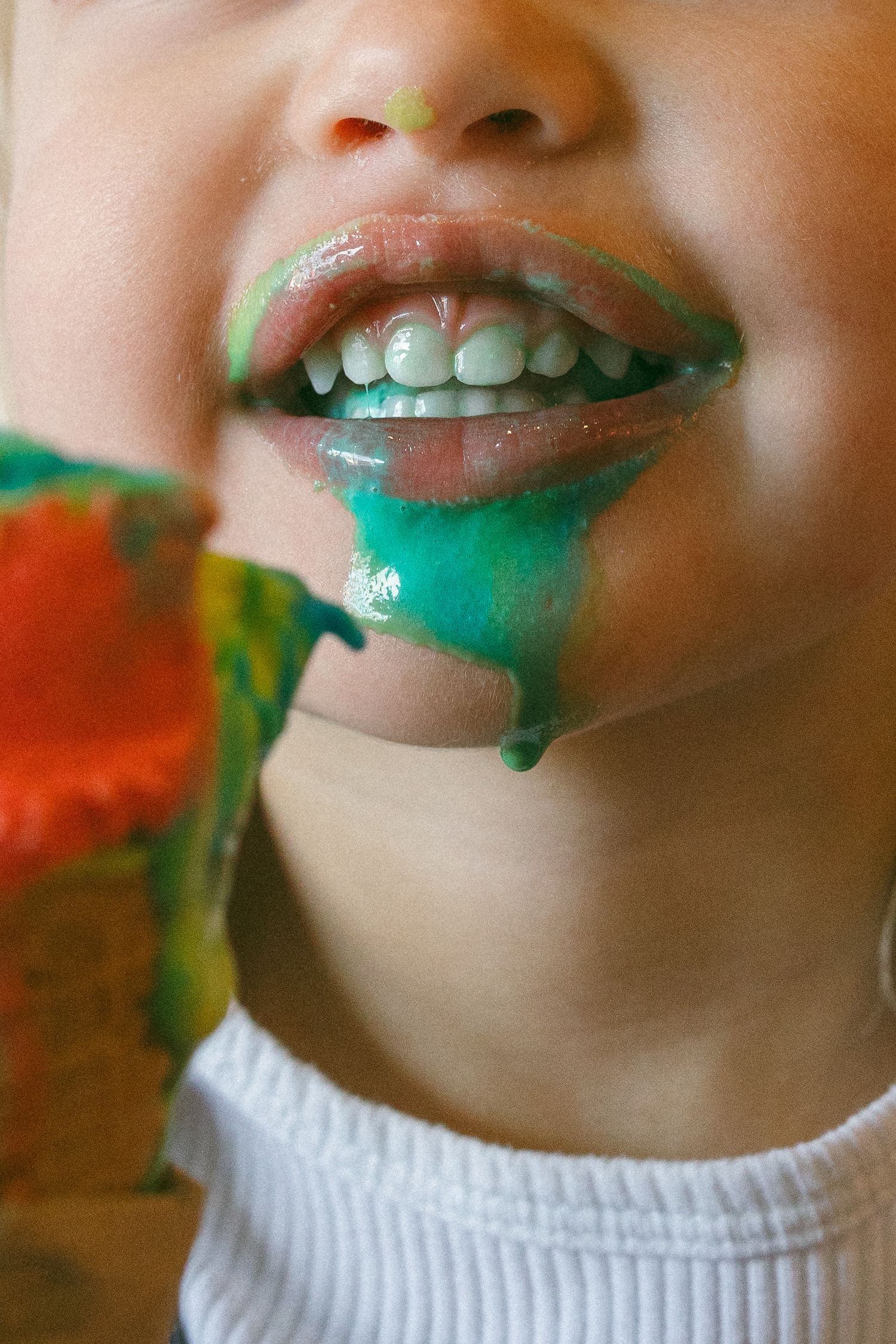 ice cream dripping of young child's face