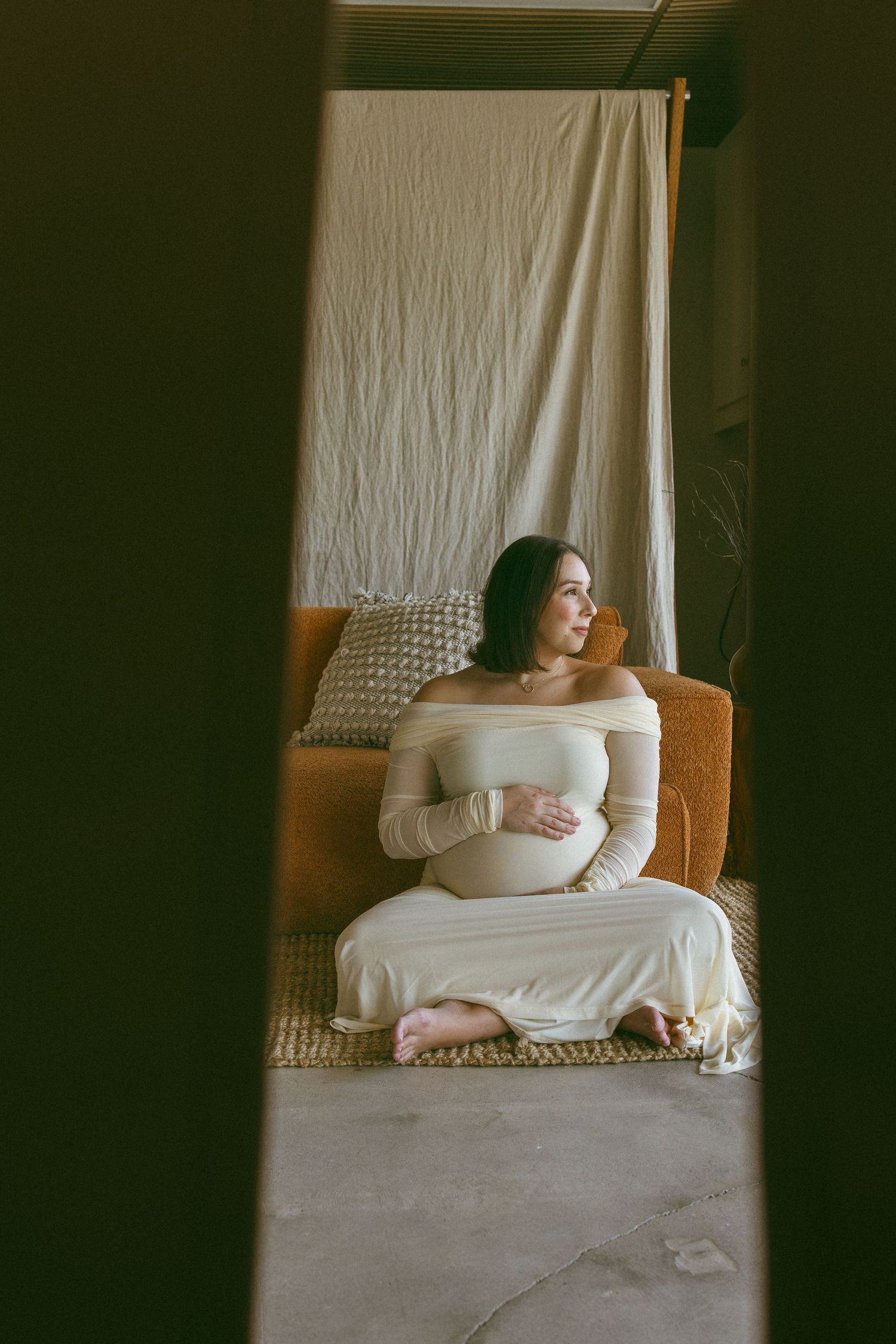pregnant mother embracing her bump