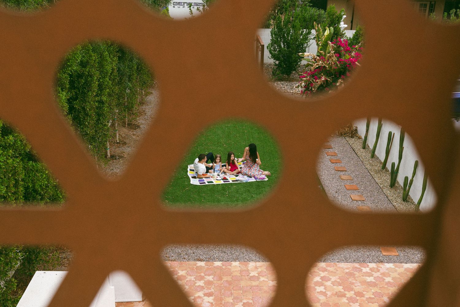 family playing on the lawn during a studio session