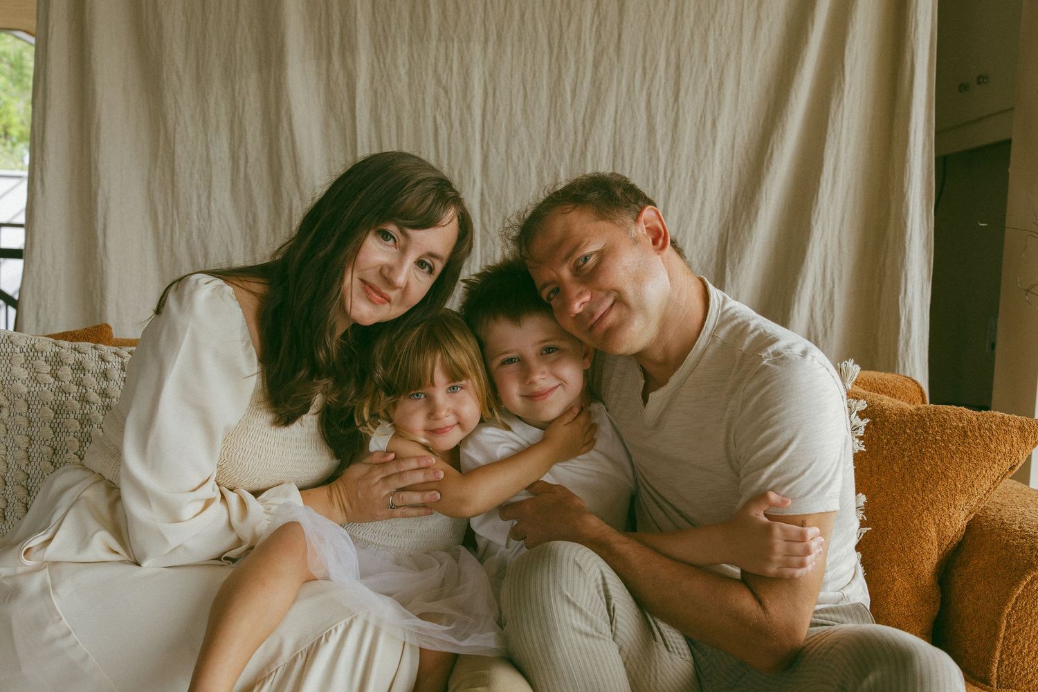 family embracing during a lifestyle session
