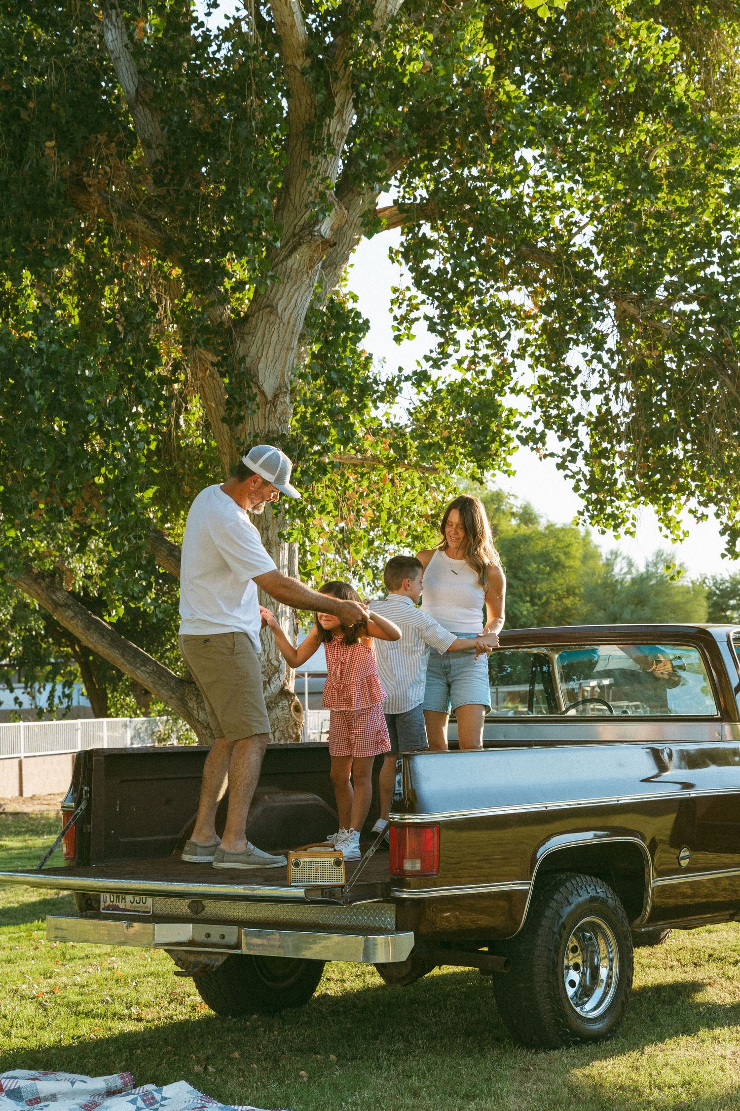 family dancing in the bed of a truck