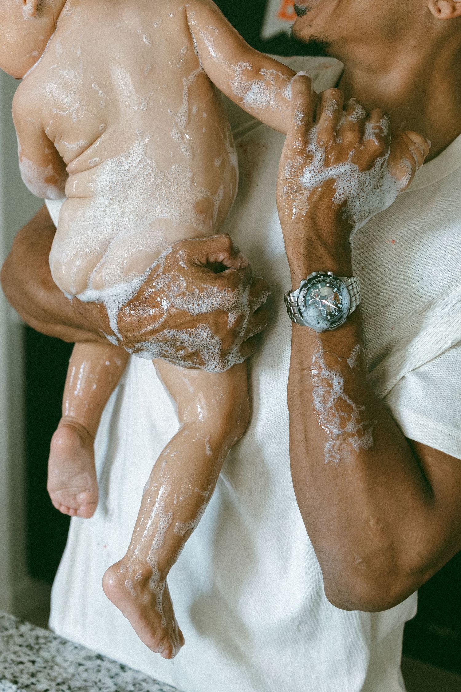 father holding daughter during a lifestyle session