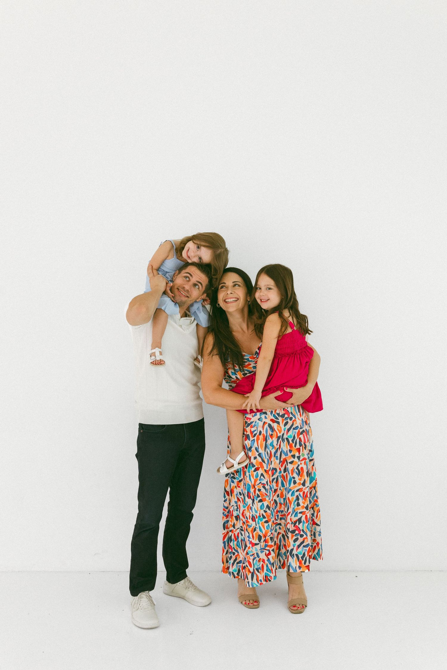 family embracing in a studio session