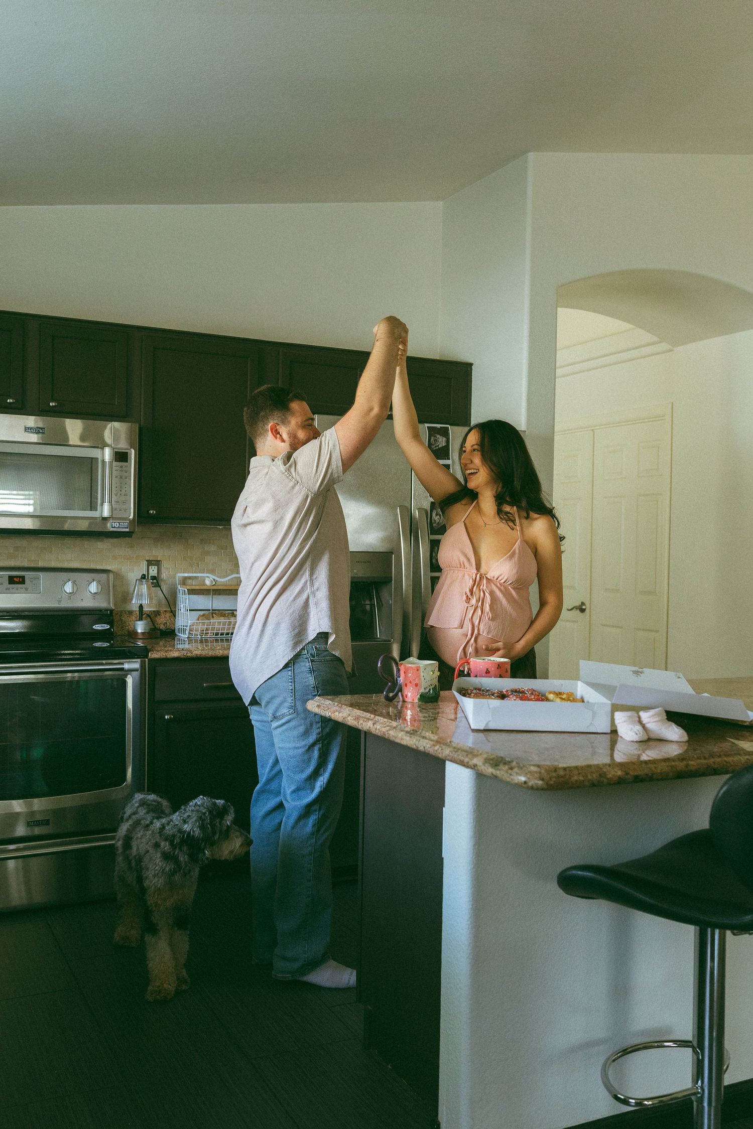 couple dancing during maternity session