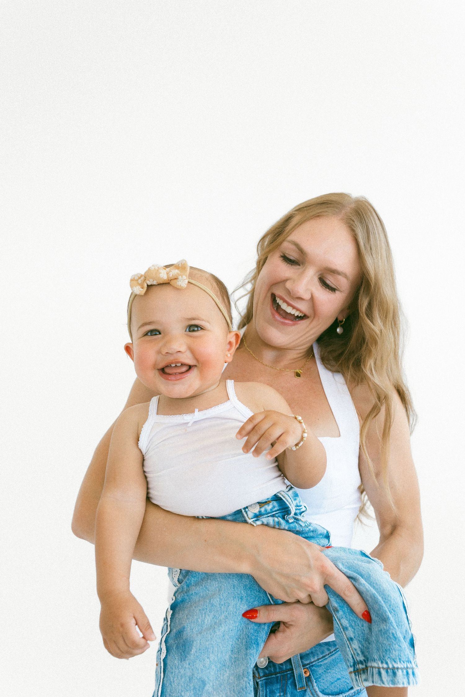woman holding her young daughter during a studio session