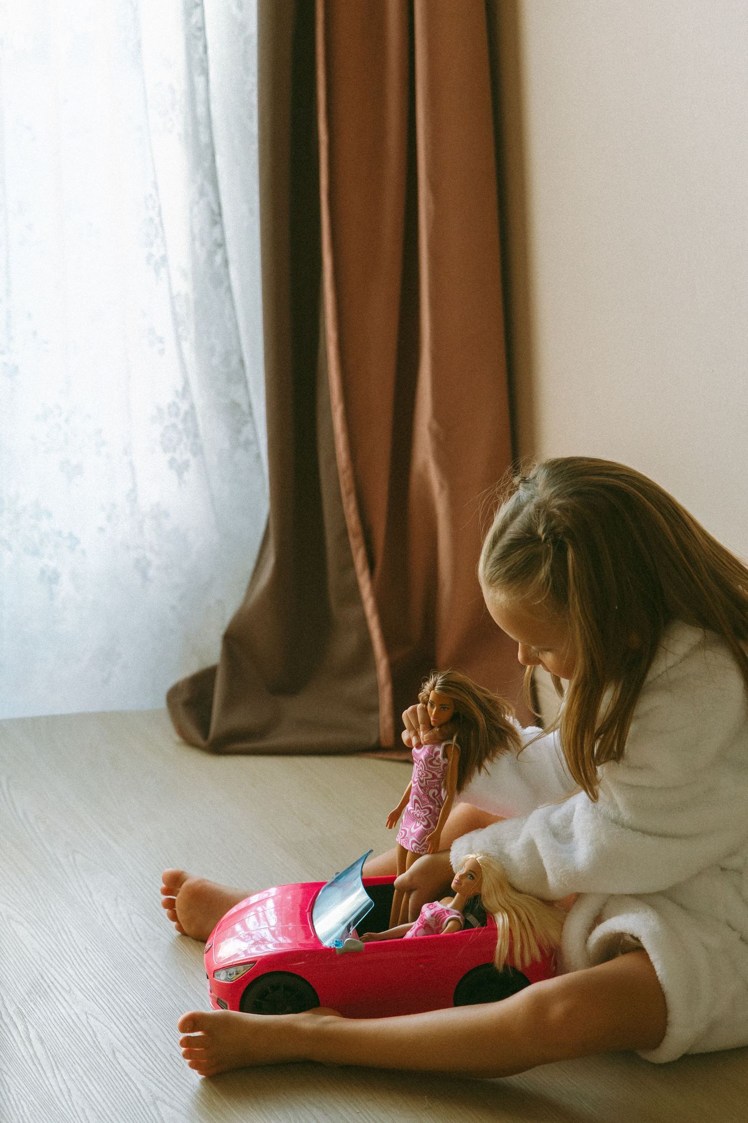 child playing with dolls