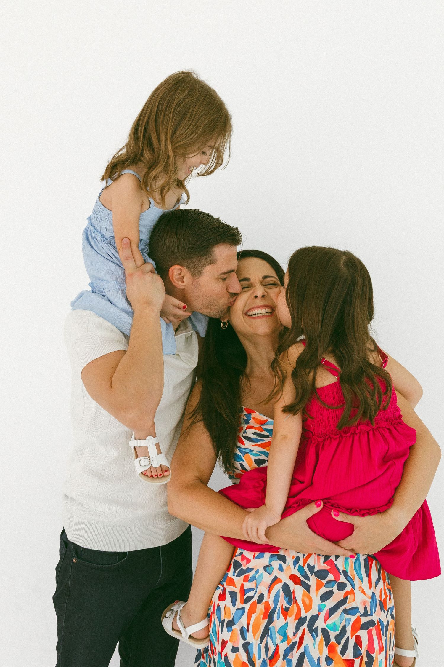 family embracing in a studio session
