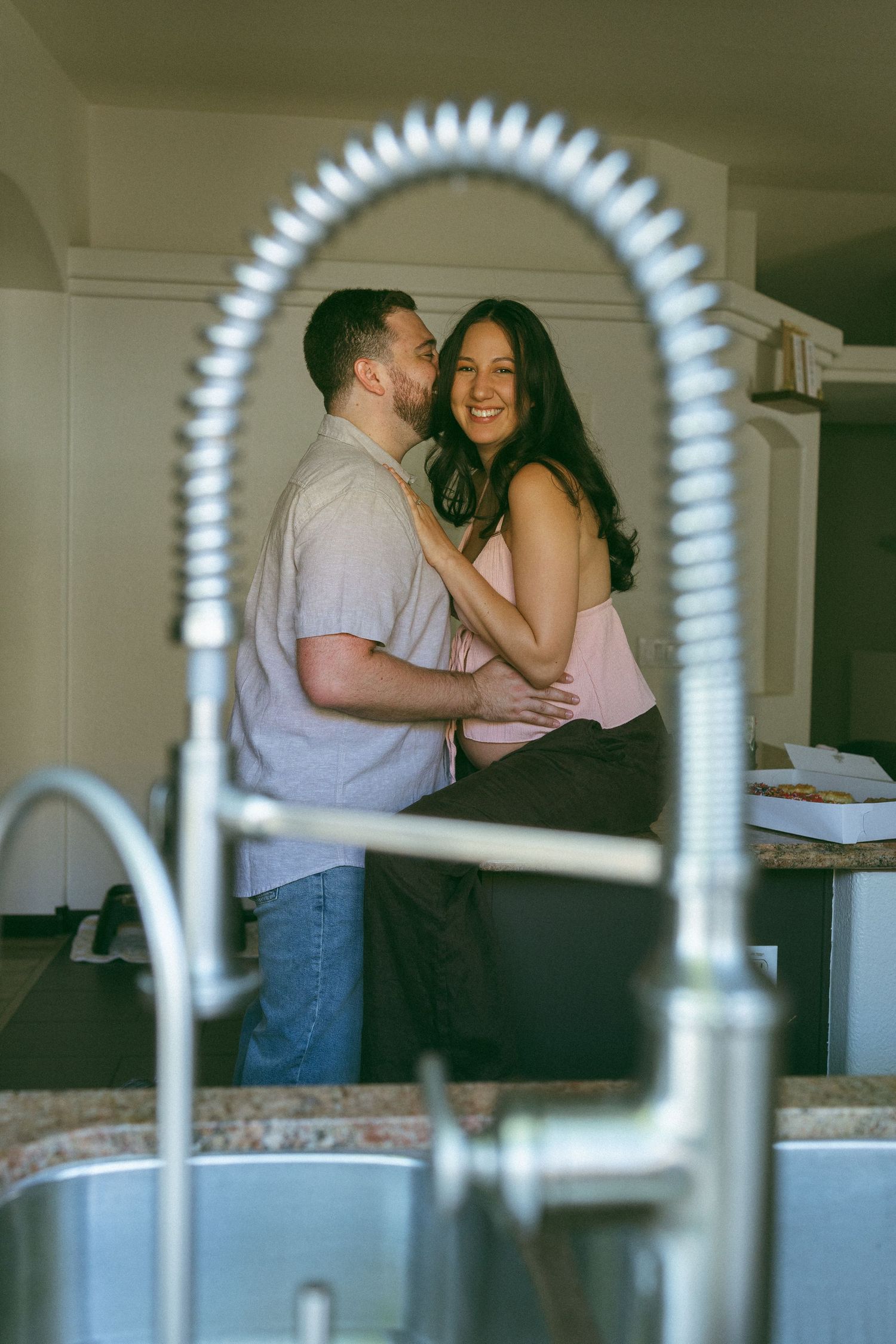 couple embracing during maternity session