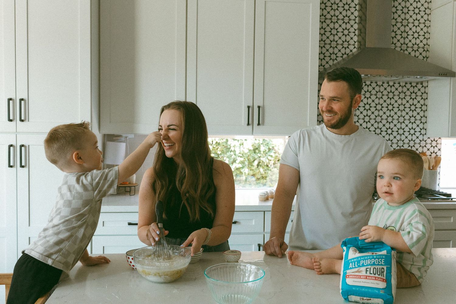 family playing in the kitchen during a lifestyle session
