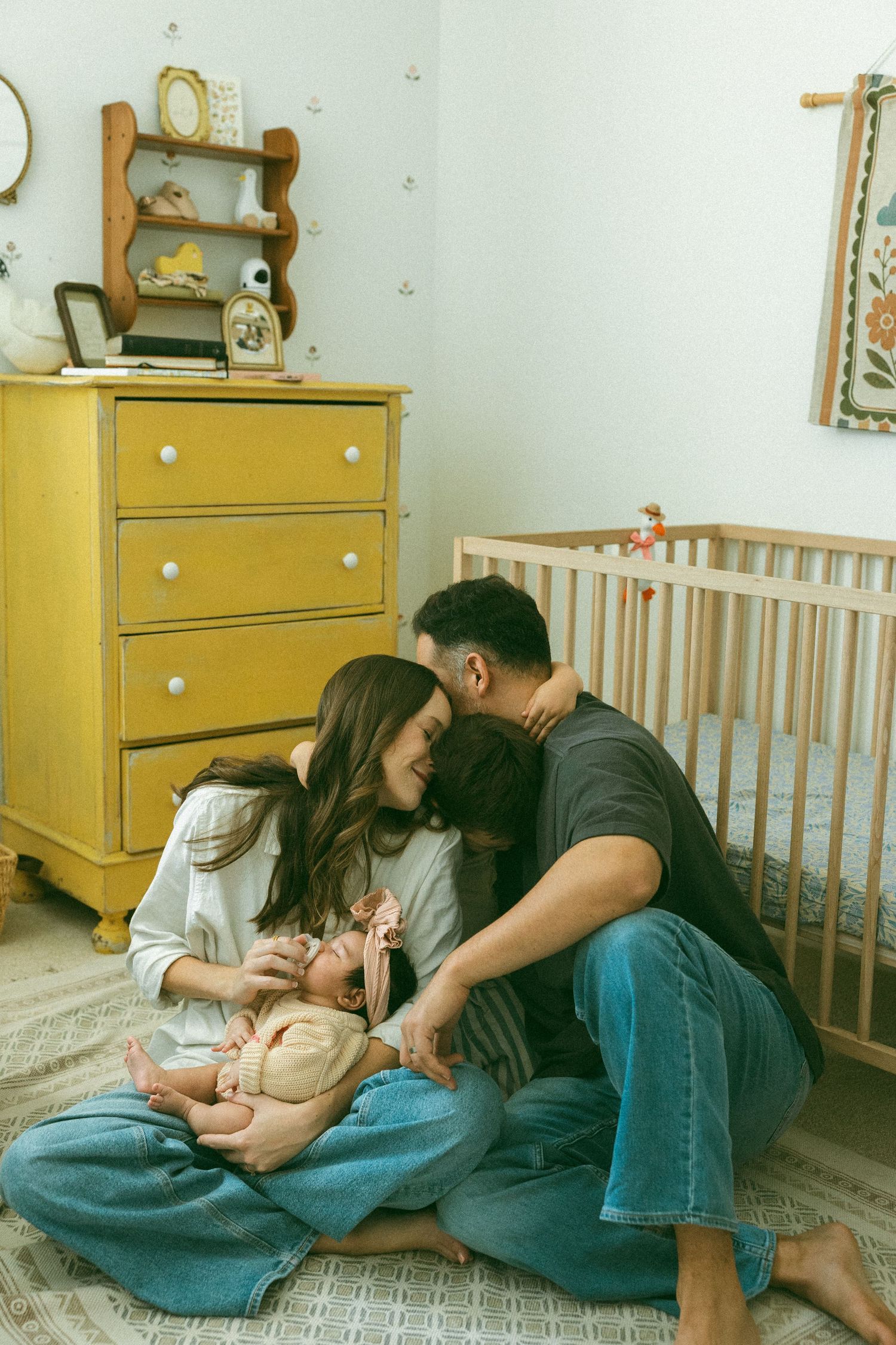 family embracing during a newborns session