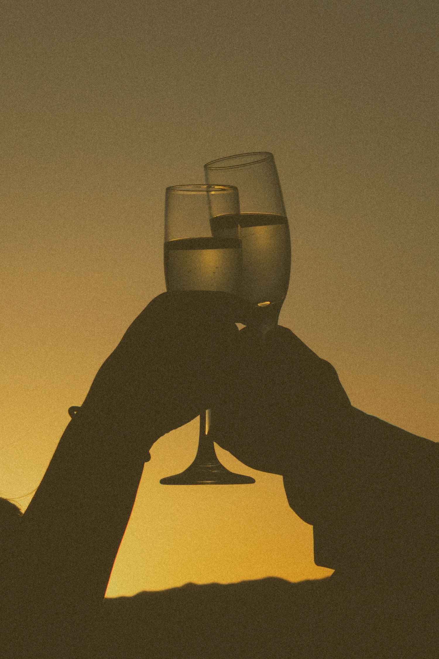 champagne flutes in the sunset