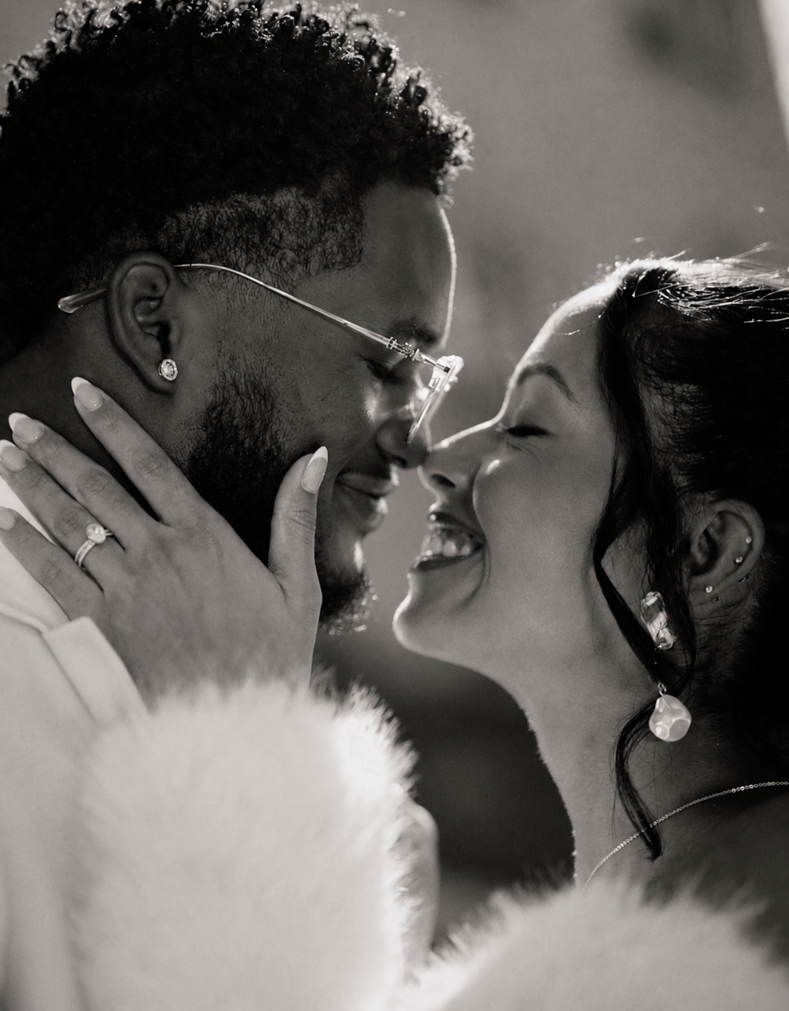 Atlanta couples photography of a couple touching foreheads and smiling in an intimate black-and-white portrait.