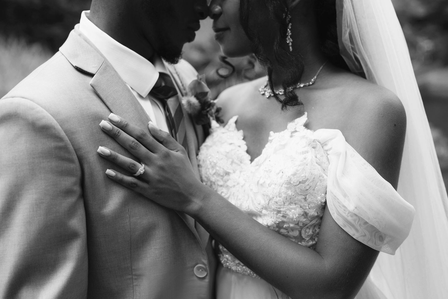 Atlanta micro-wedding photography of a bride and groom sharing an intimate moment in a black-and-white portrait.
