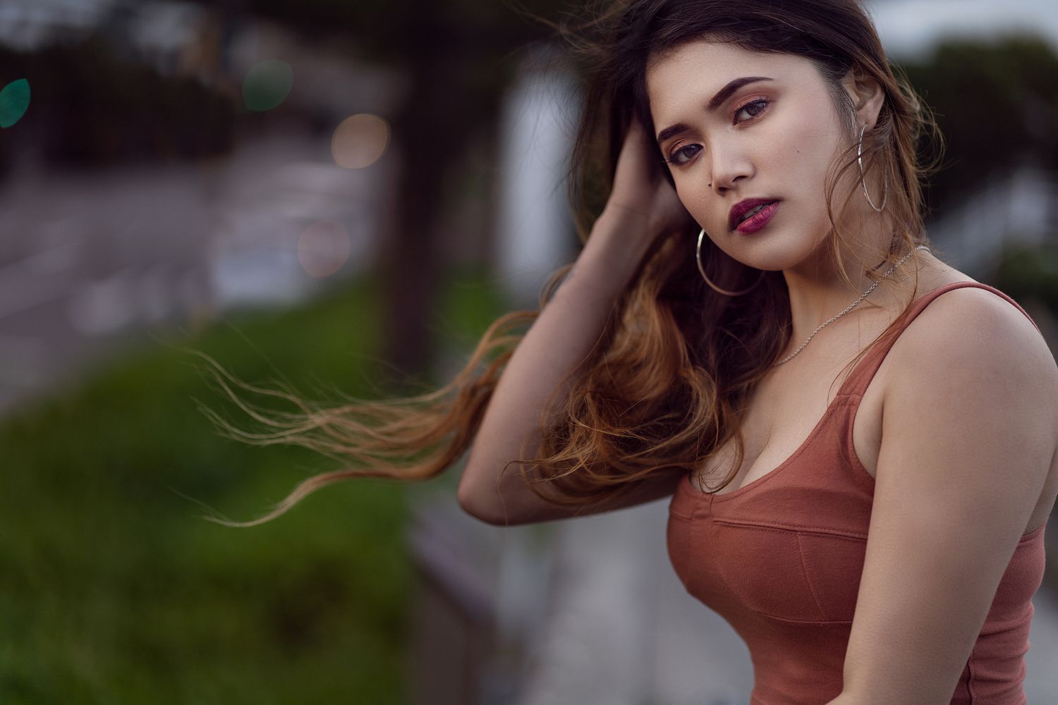 Outdoor portrait series with warm lighting and urban setting.