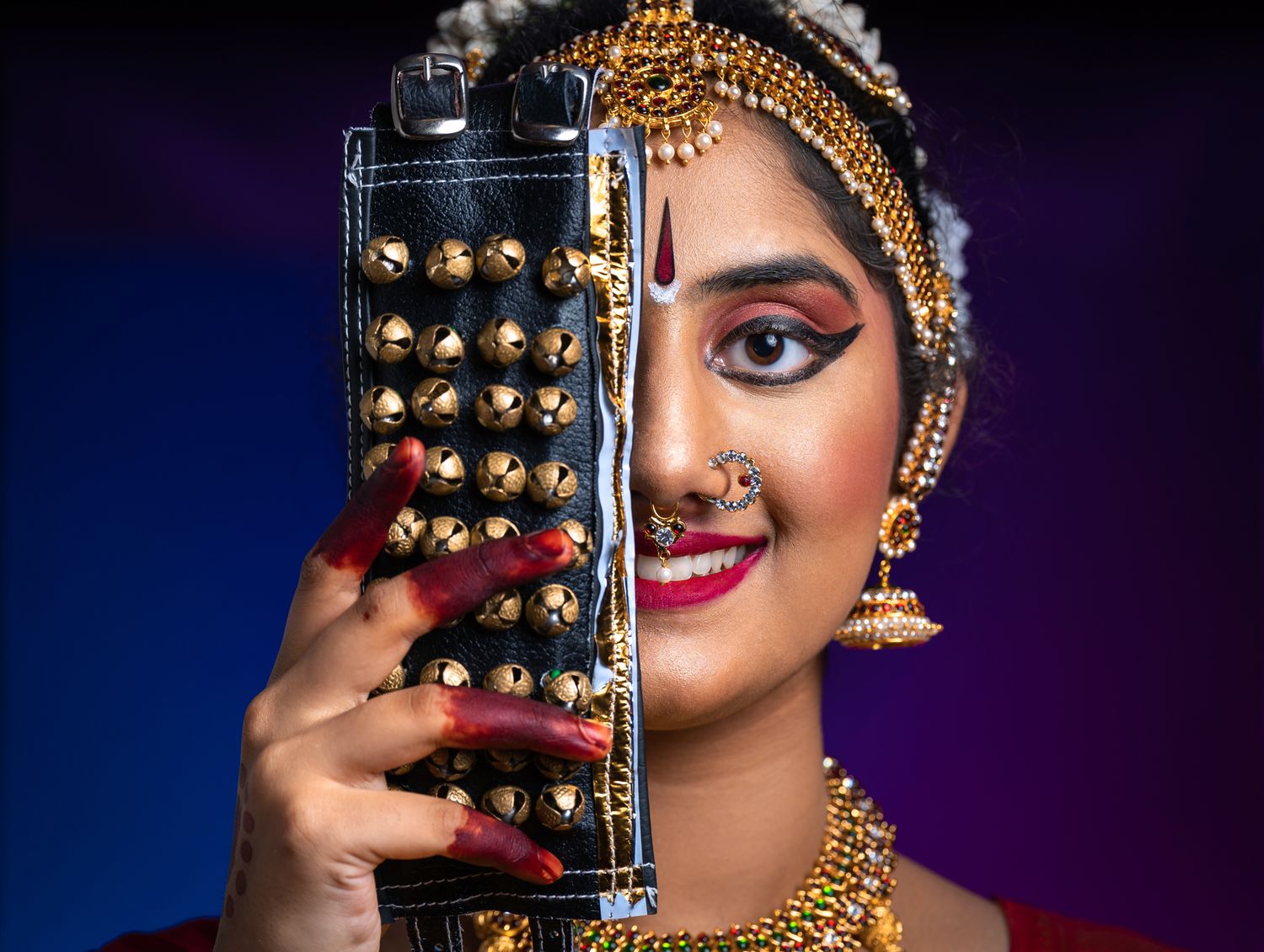 Portrait of a Bharatanatyam dancer women in studio with anklets