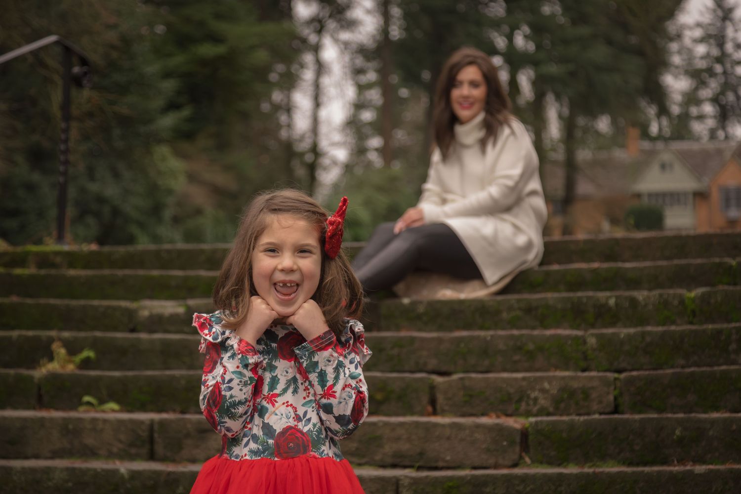 A mother and daughter posing together.