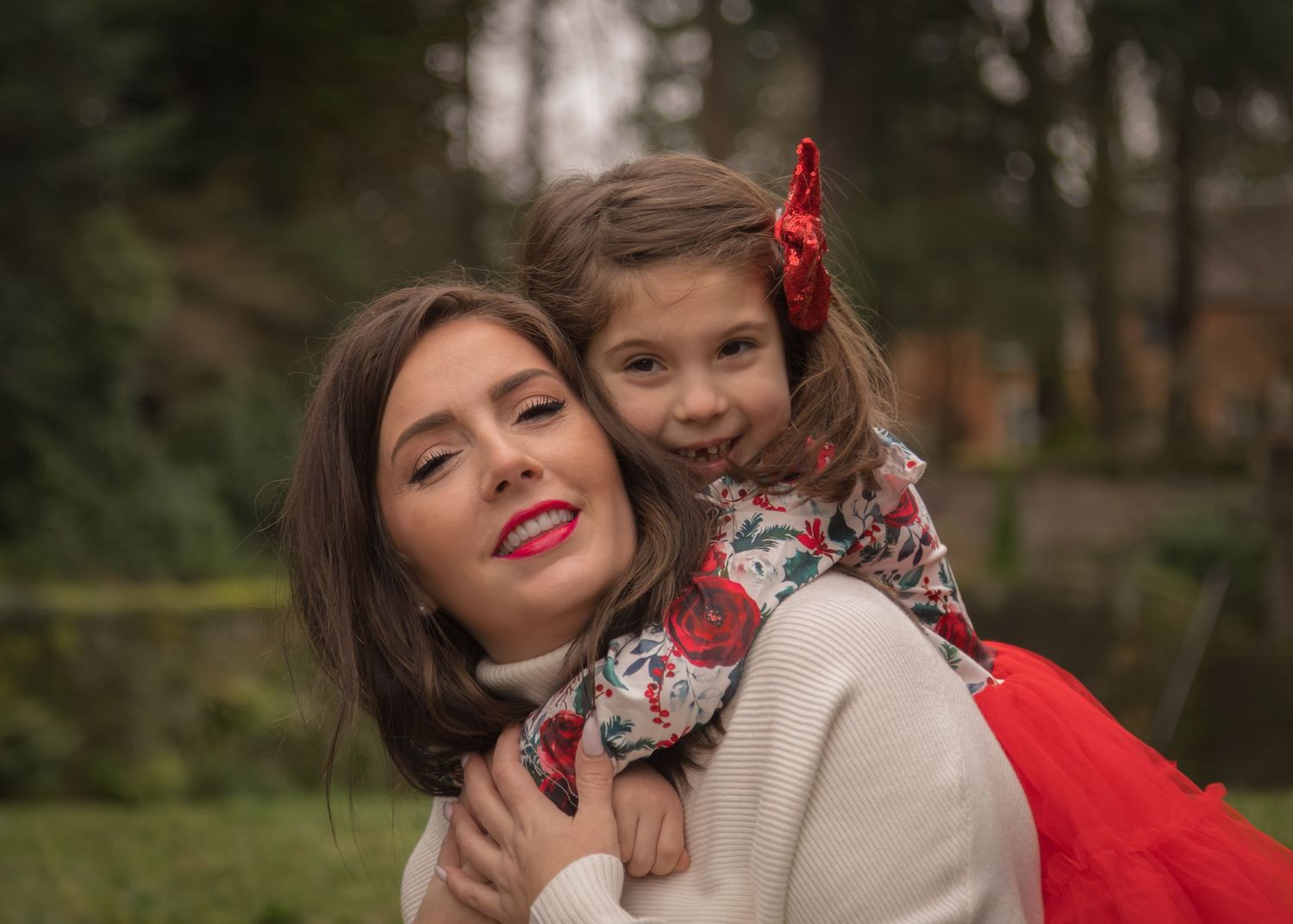 A mother and daughter posing together.