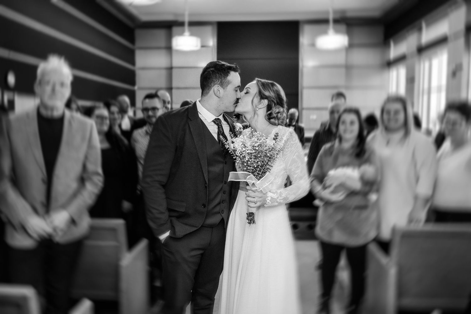 A sequence of black and white wedding reception photos showing guests dancing and celebrating on the dance floor.