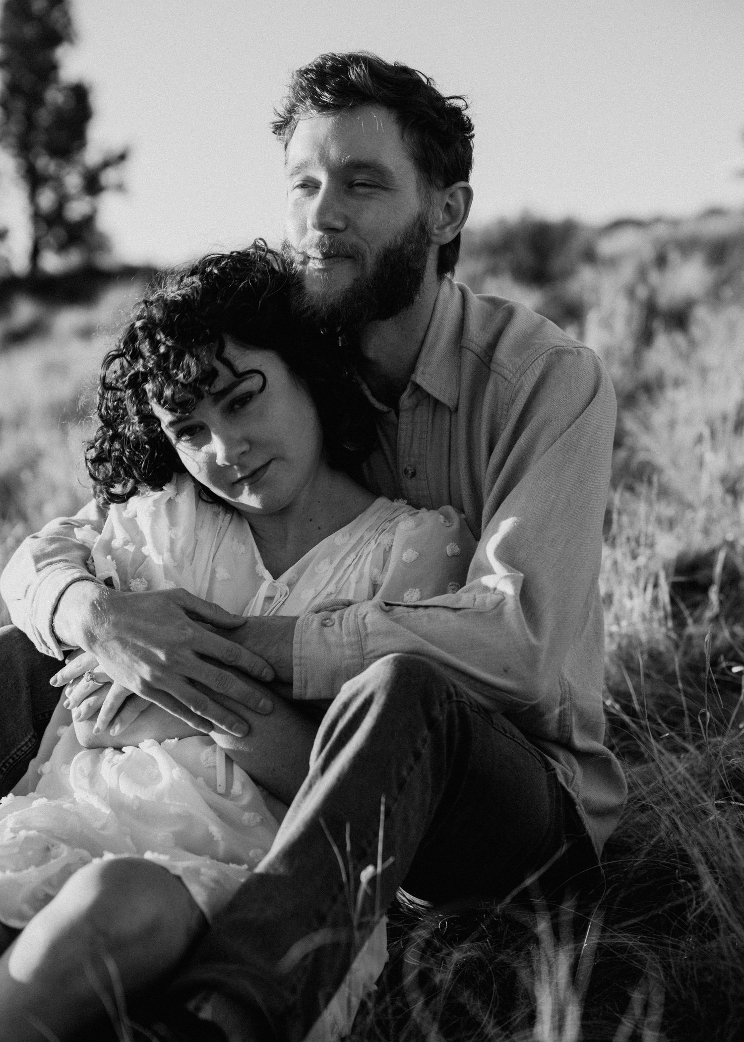 Black and white engagement portrait of couple during a Taos New Mexico session in a natural outdoor setting
