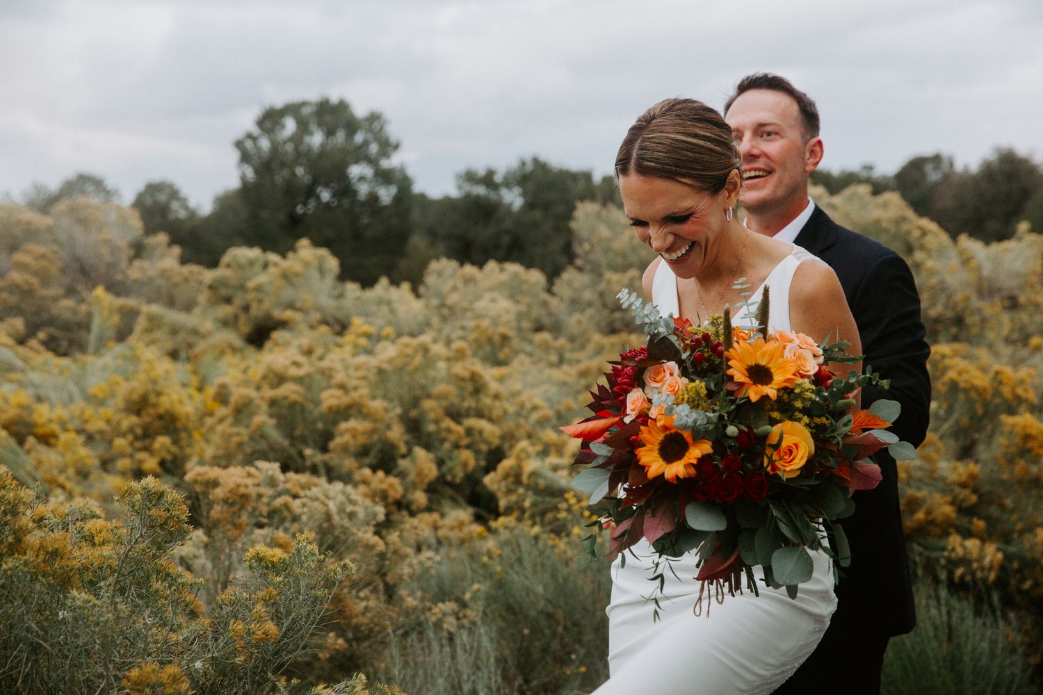 A series of wedding photos showing a couple embracing in a field of yellow wildflowers during golden hour.