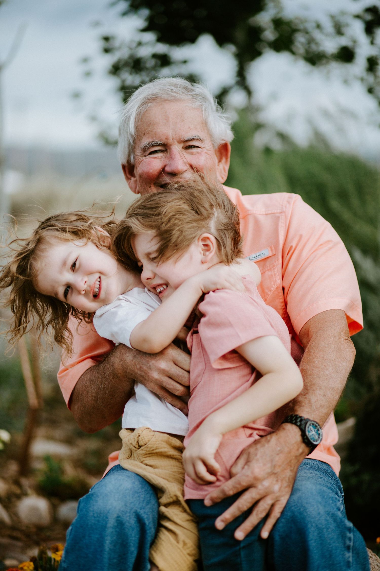 A heartwarming series showing affectionate playtime moments in a garden setting.