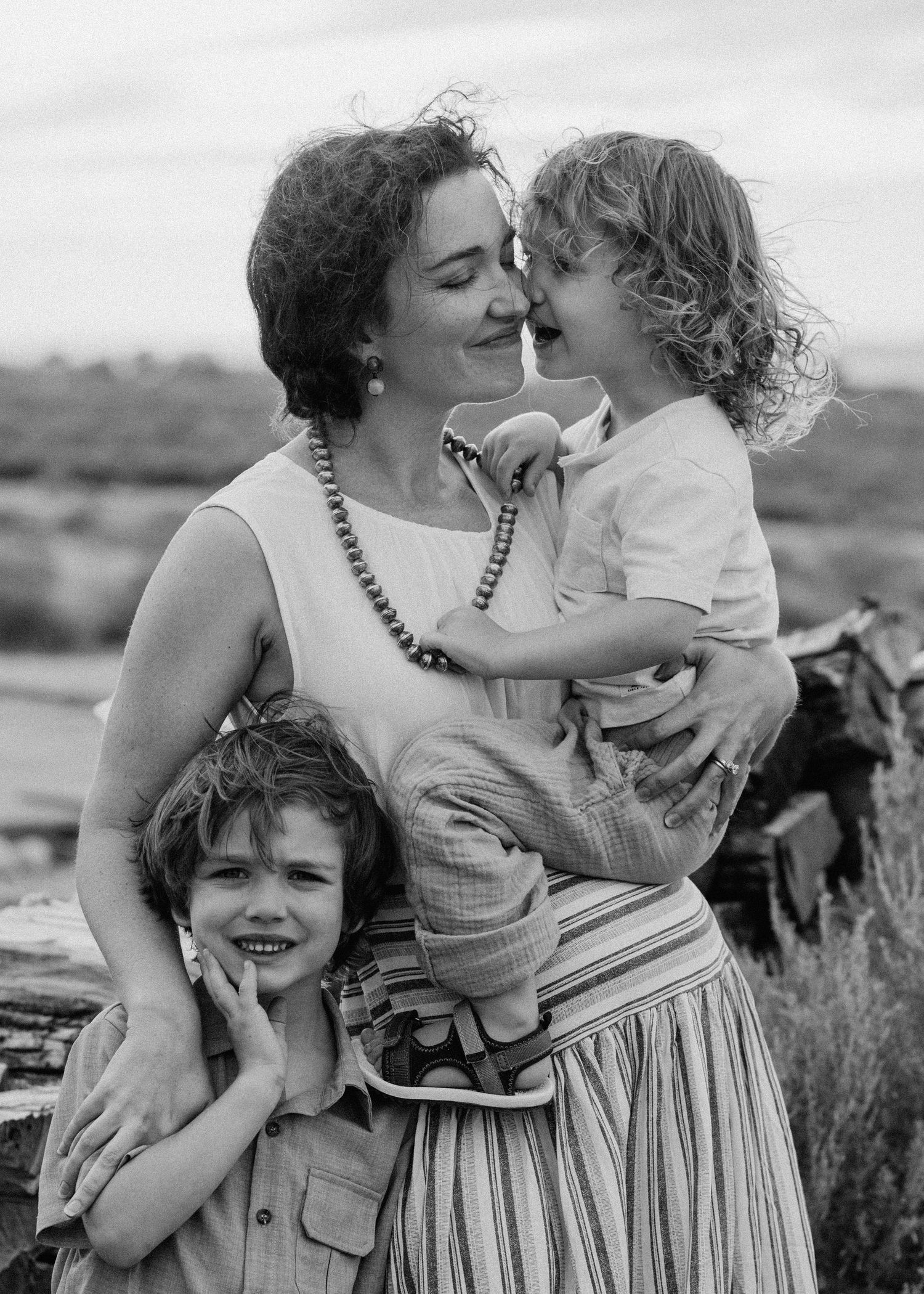 Series of candid outdoor family moments captured against a natural landscape.