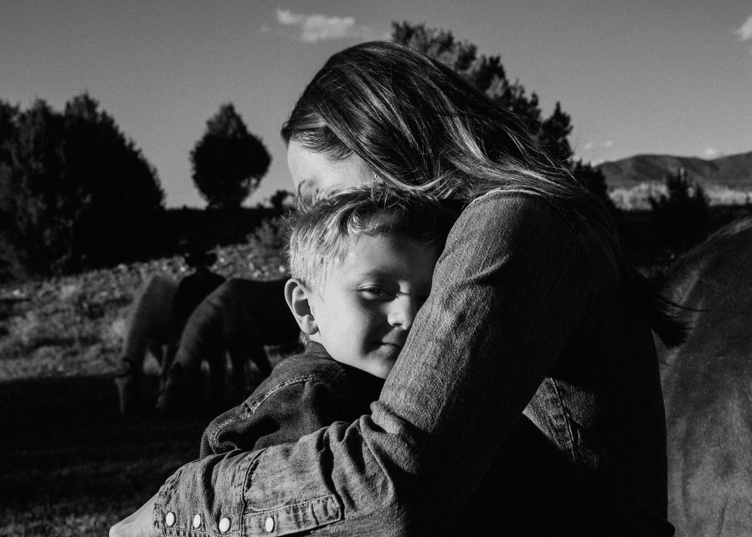 Intimate black and white moment shared with horse in mountain setting.  Shot in Taos, NM by Siouxzen Kang