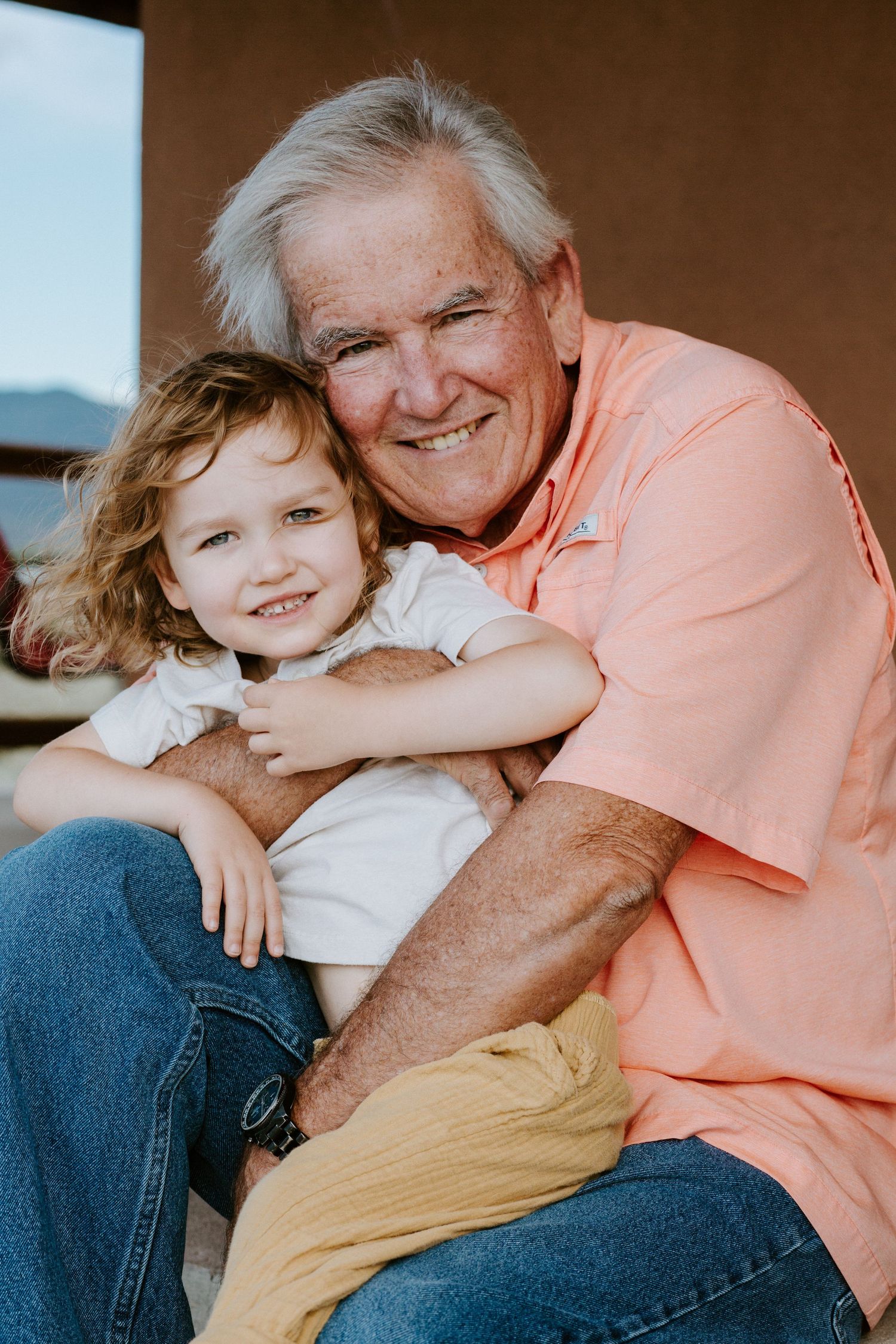A heartwarming series of candid moments showing affectionate interaction between an elderly person and child.