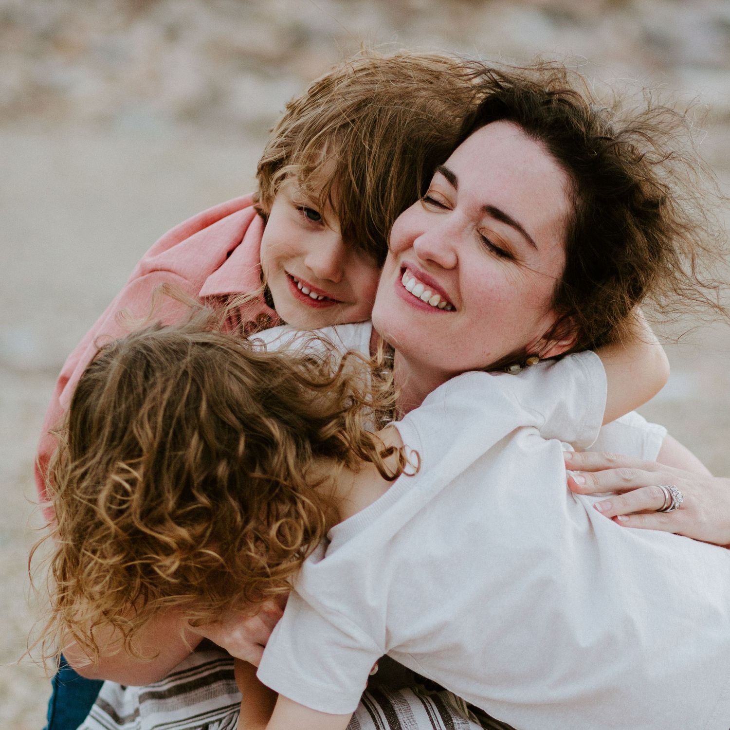Close-up photos showing affectionate embraces and genuine laughter between loved ones.