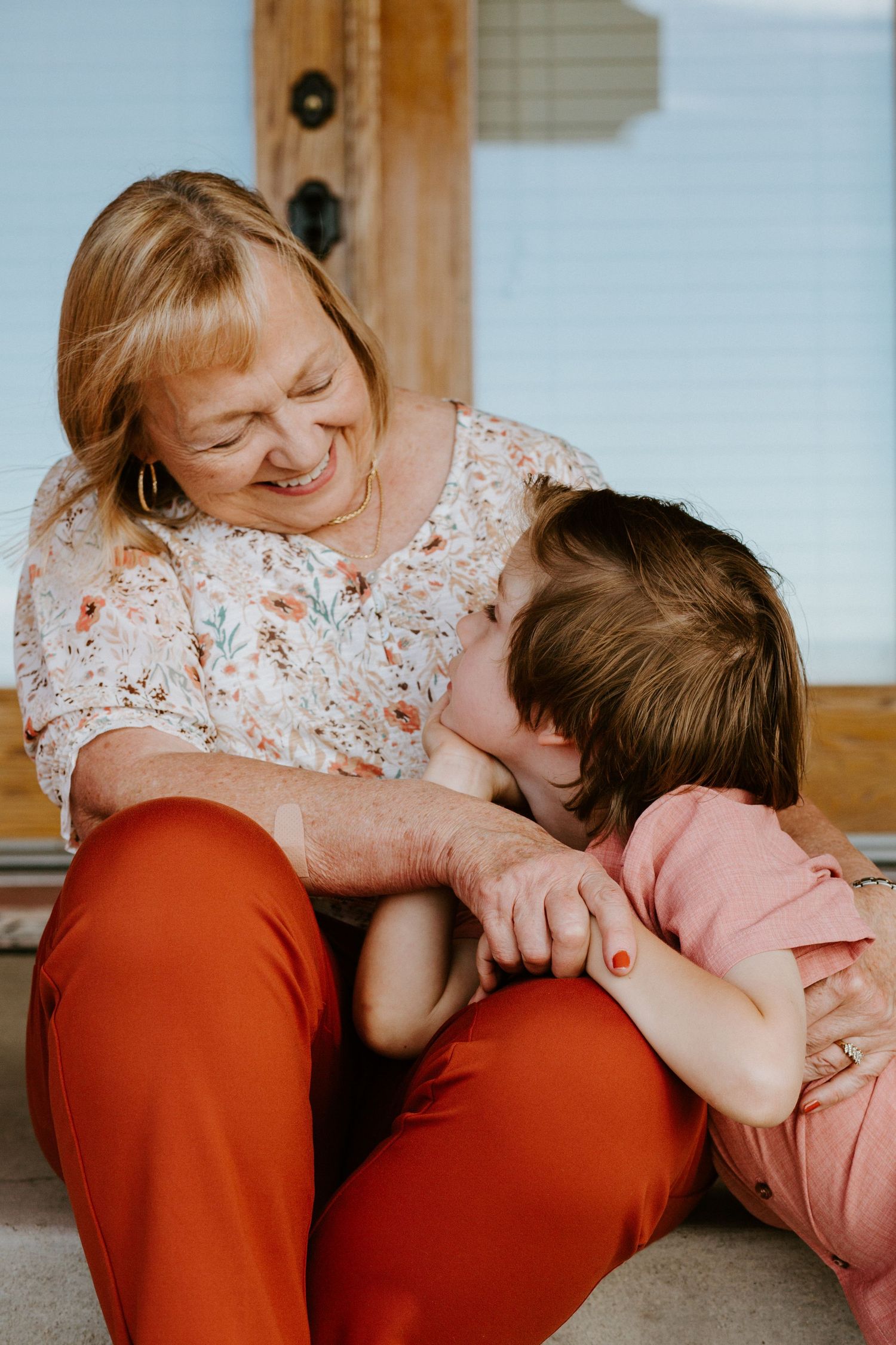 A series of playful candid moments showing affectionate interaction between parent and child on a couch.