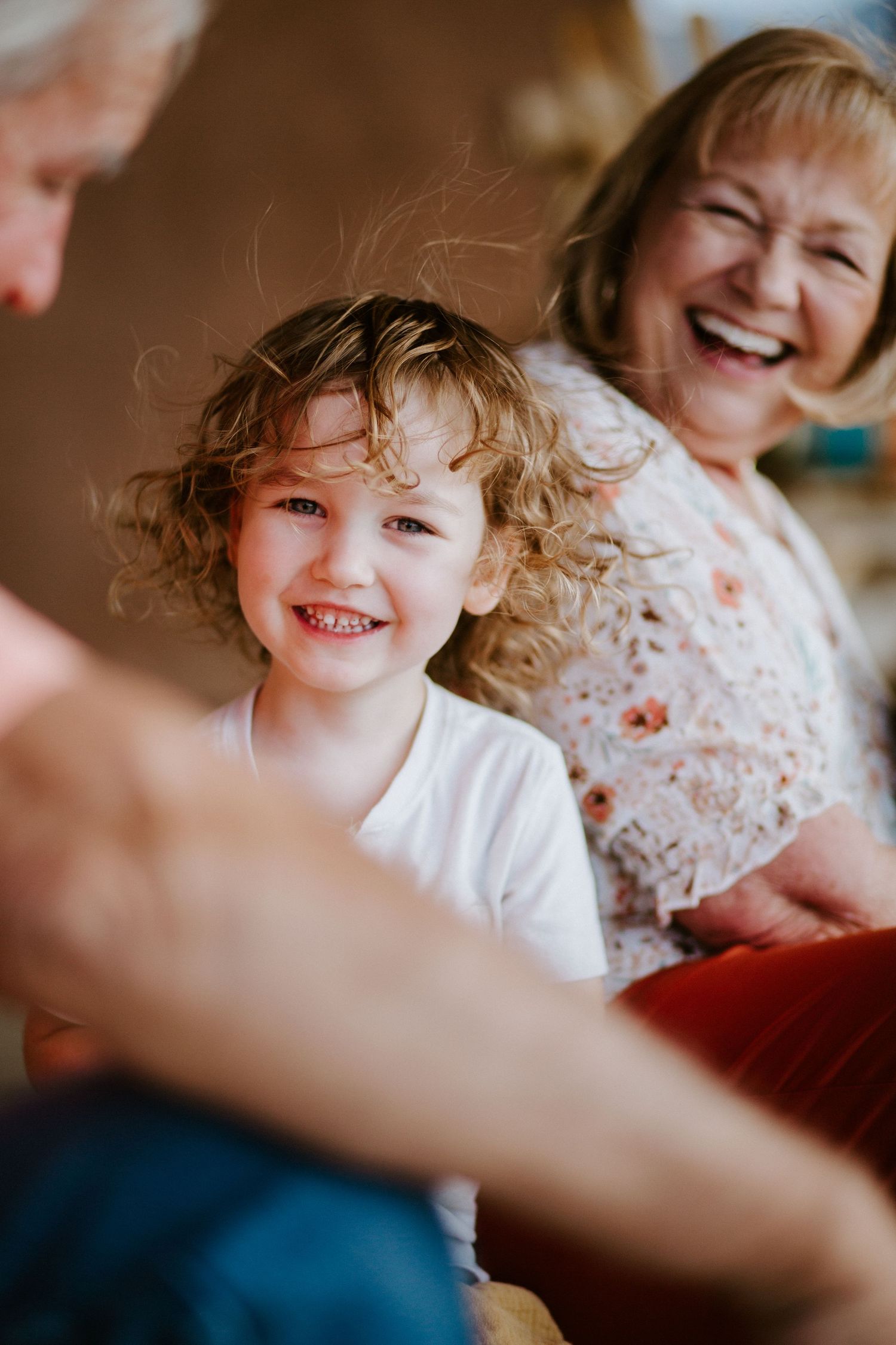 Close-up shots of joyful laughter during an intimate family moment.