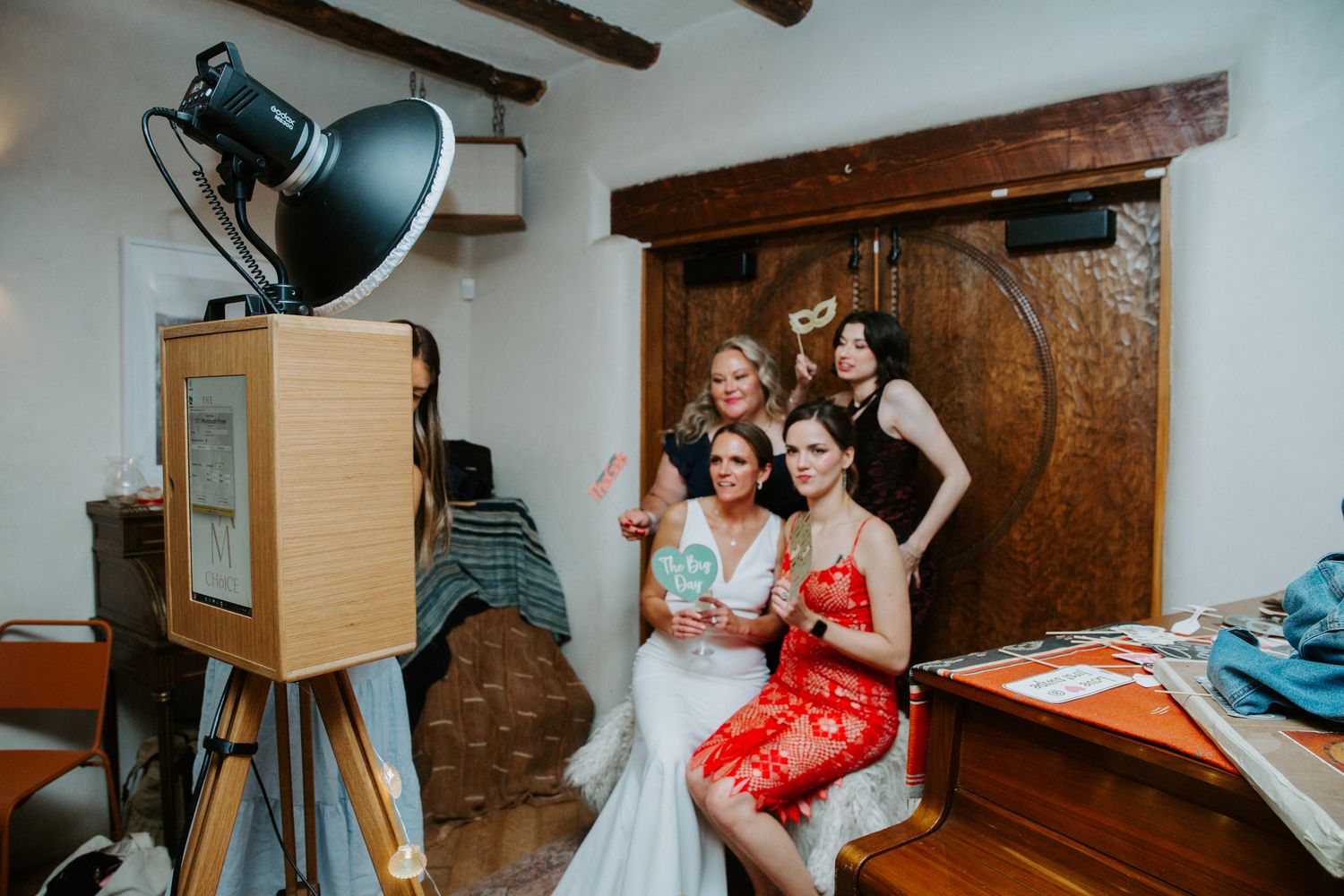 A sequence of candid moments captured in a rustic interior space during a wedding preparation session.