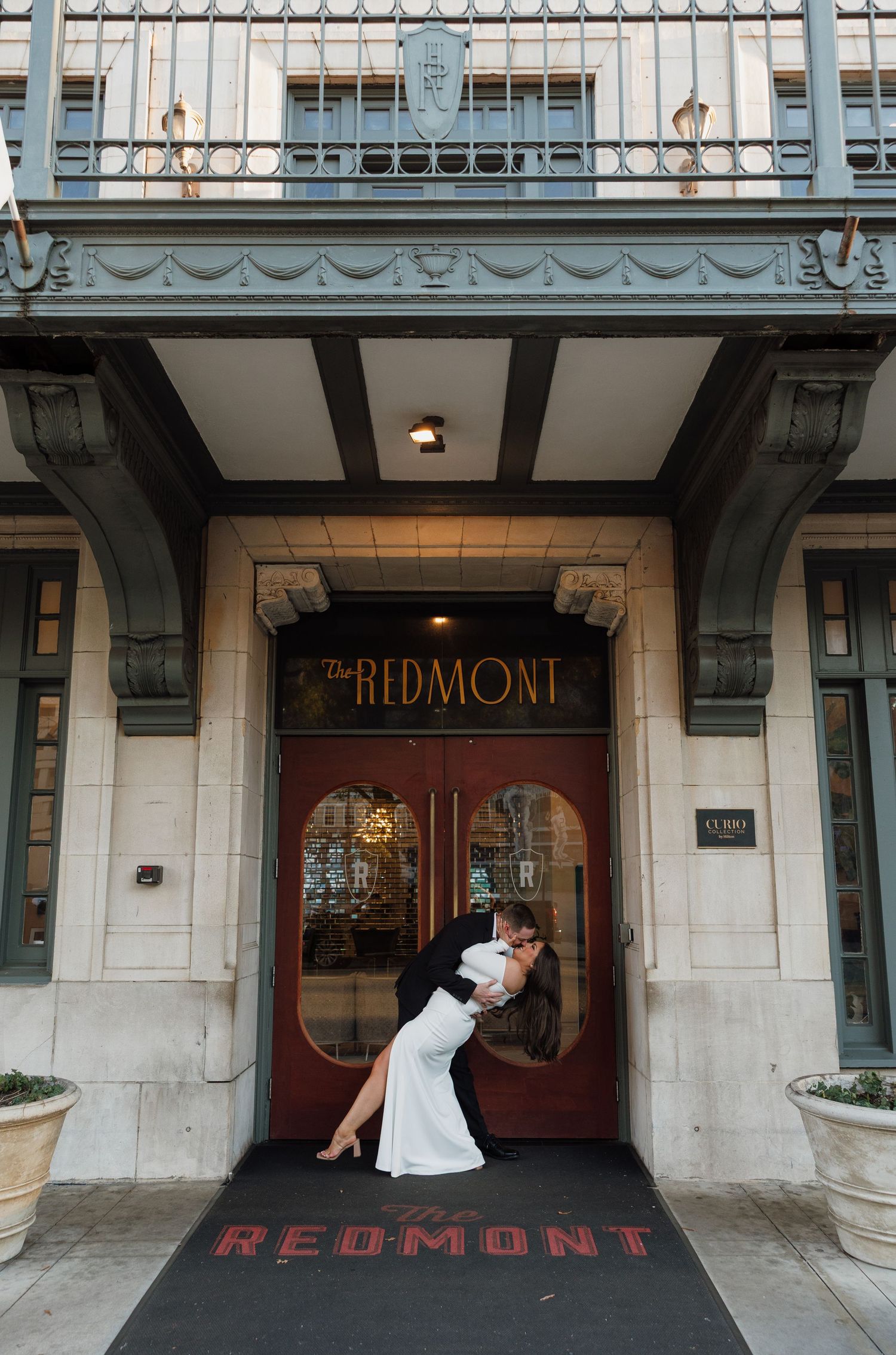 Dramatic wedding photo at the entrance of the historic Redmont Hotel.