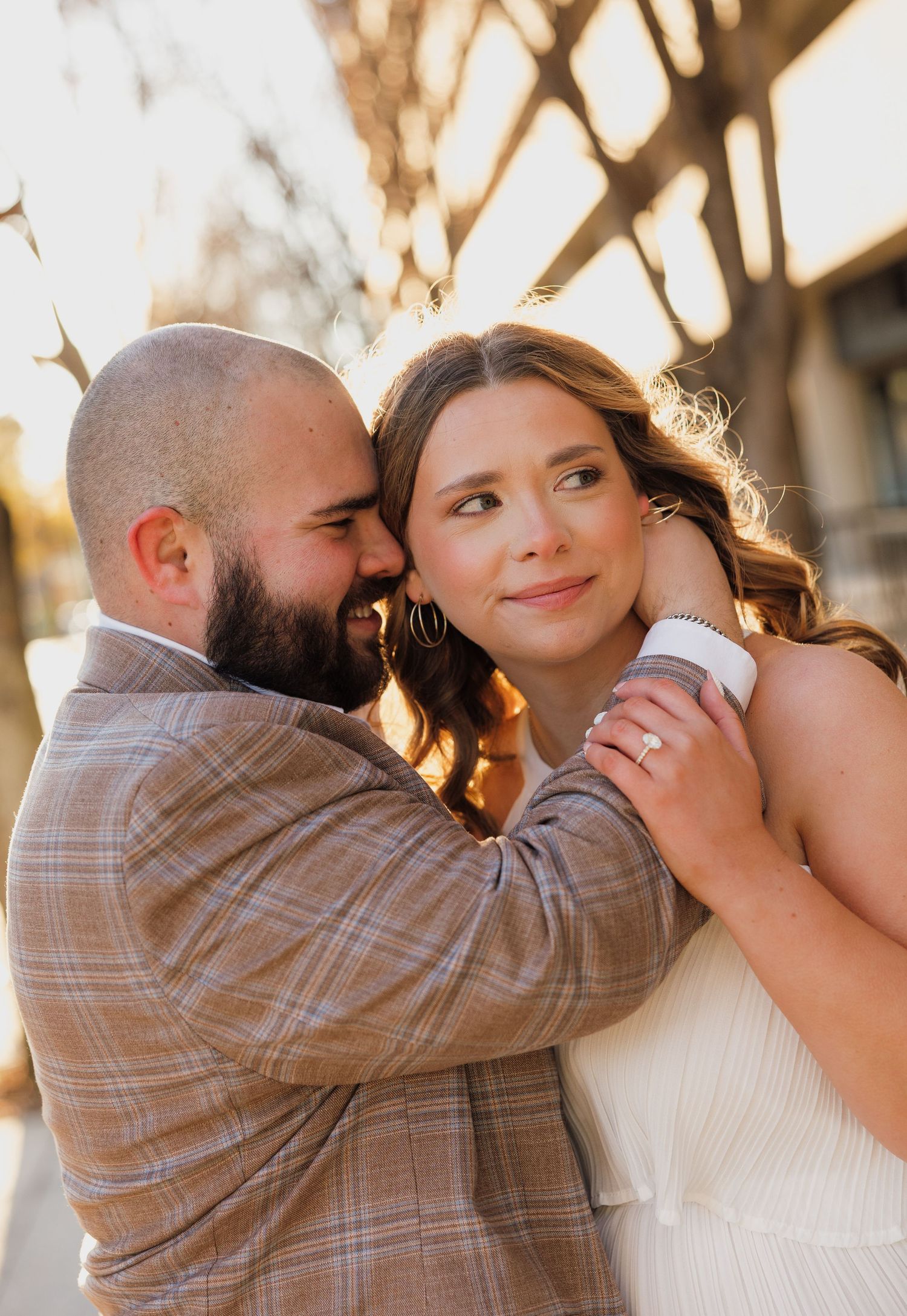 Romantic couple embracing in a series of intimate poses at sunset.