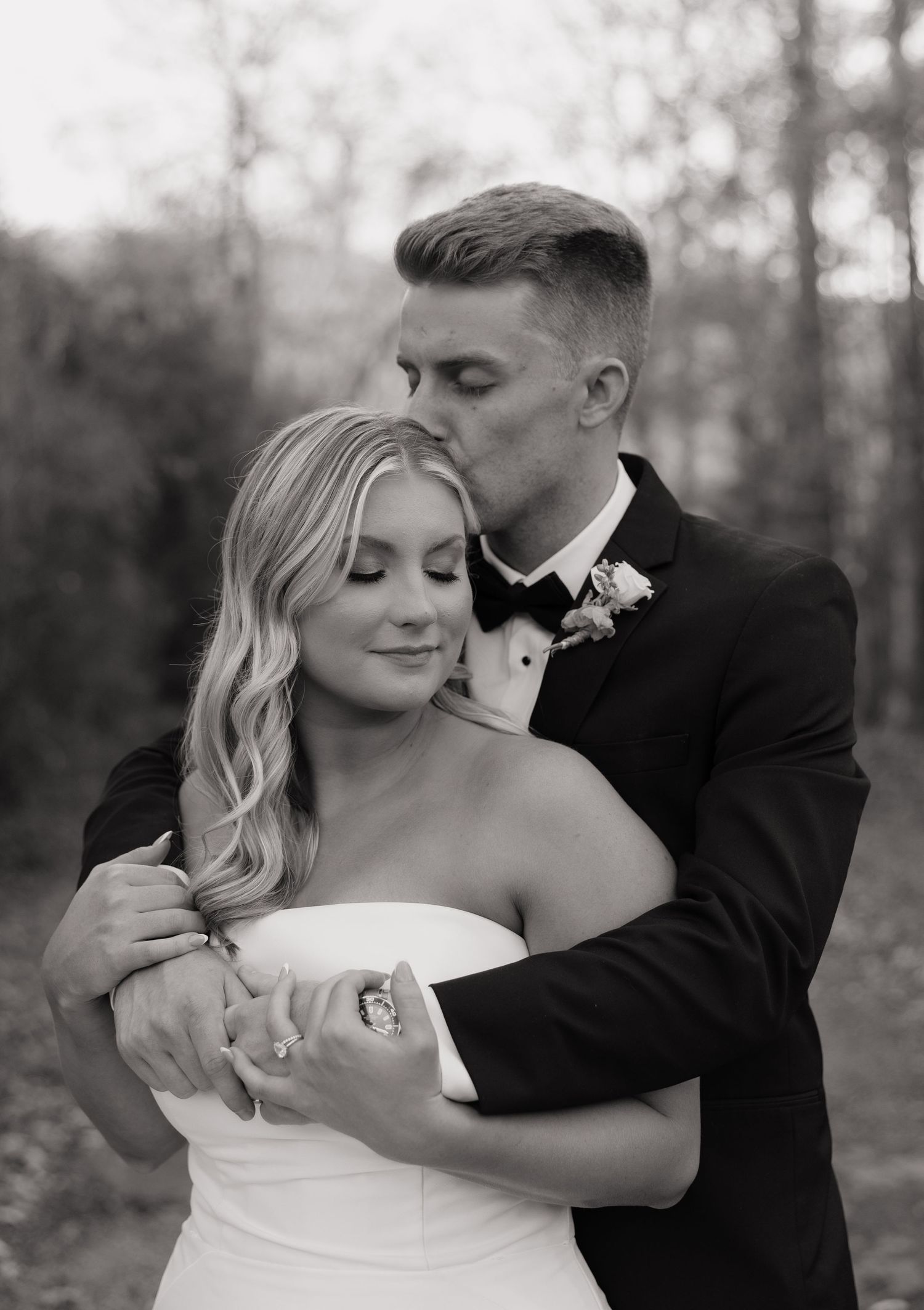Black and white romantic wedding portraits showing tender moments between newlyweds.